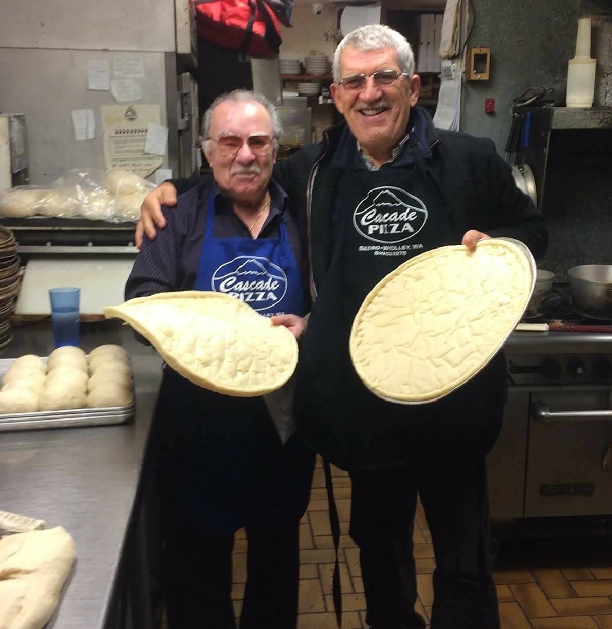 Cascade Pizza founder Nick & Partner John holding pizza dough