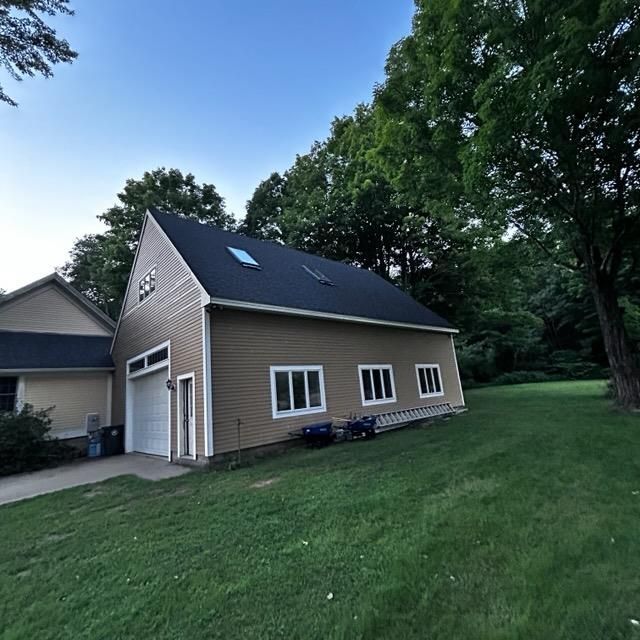 A gutter guard installed on a residential roof.