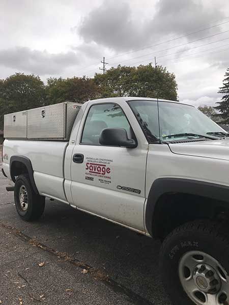White pickup truck with aluminum storage boxes; 