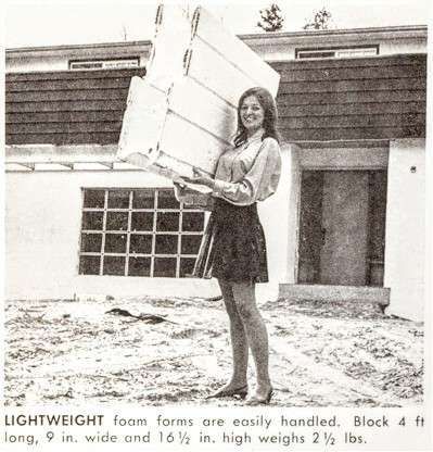 A black and white photo of a woman carrying a block of lightweight foam -AR ICF builders