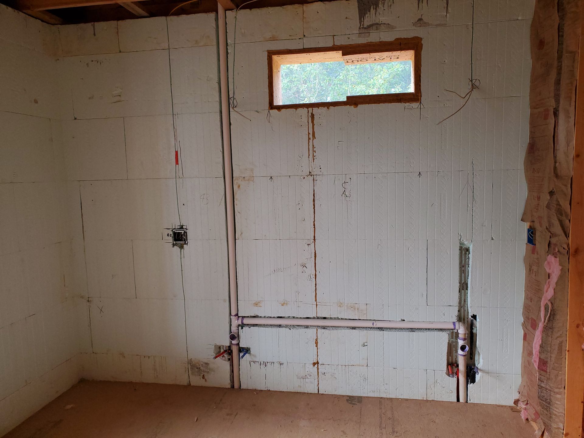 2 plumbing lines running the height of the ICF wall in an ICF home under construction in Jefferson City, Missouri