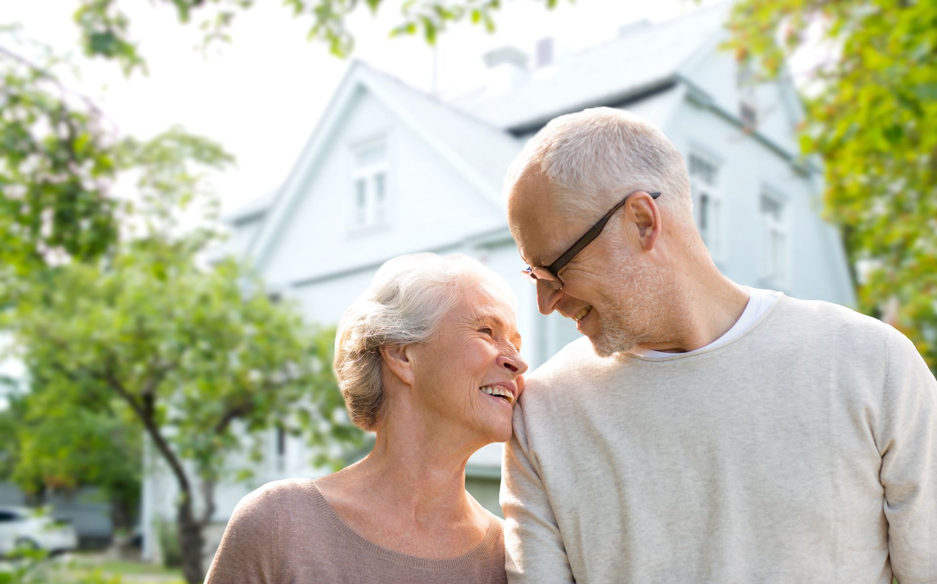 Elderly couple standing in front of custom ICF home | Fayetteville, A