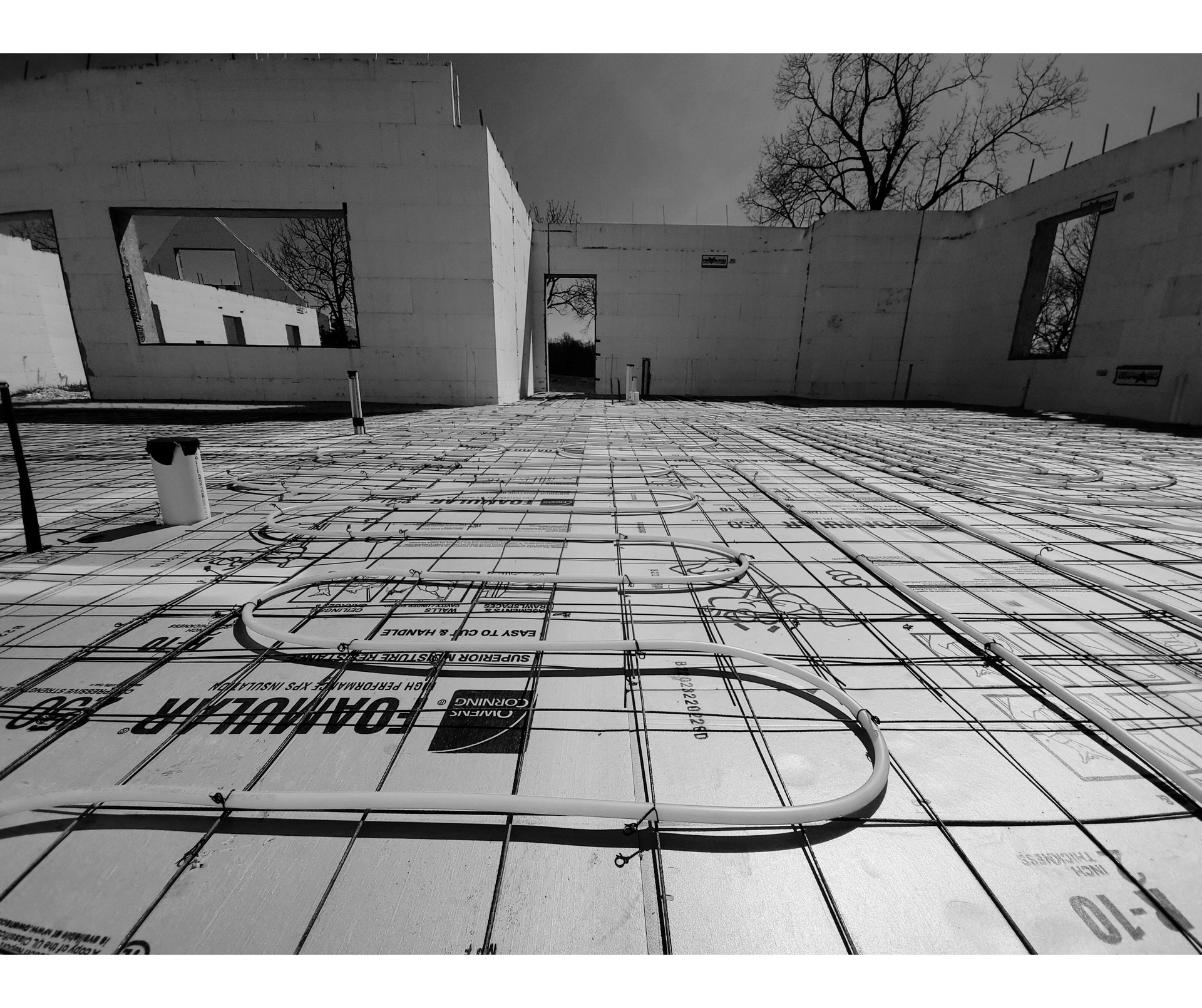 A black and white photo of radiant heat tubing in an ICF home under construction | Kansas City, MO