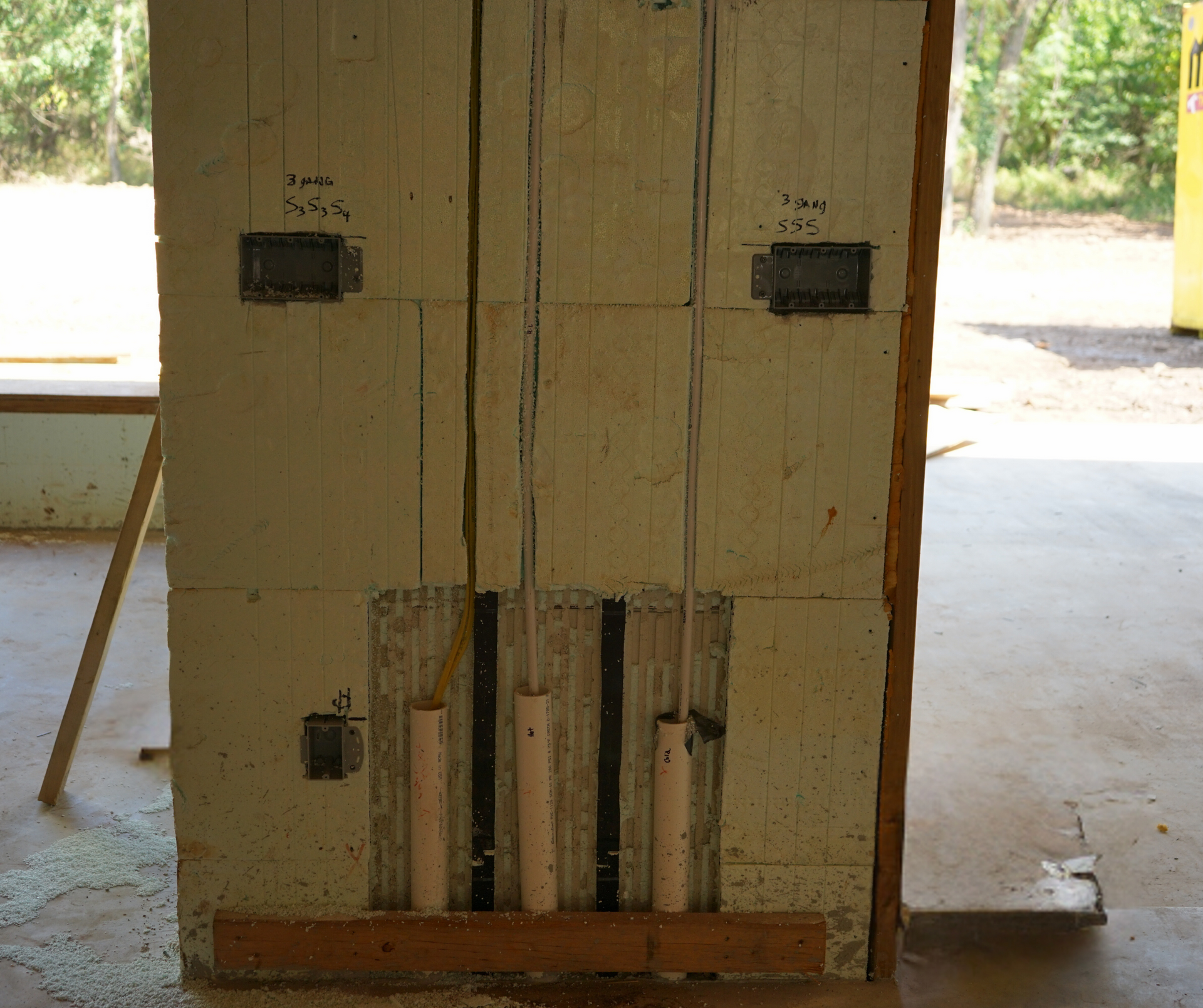 Plumbing pipes, Electrical lines, and conduits being ran through an ICF wall in Joplin, Missouri