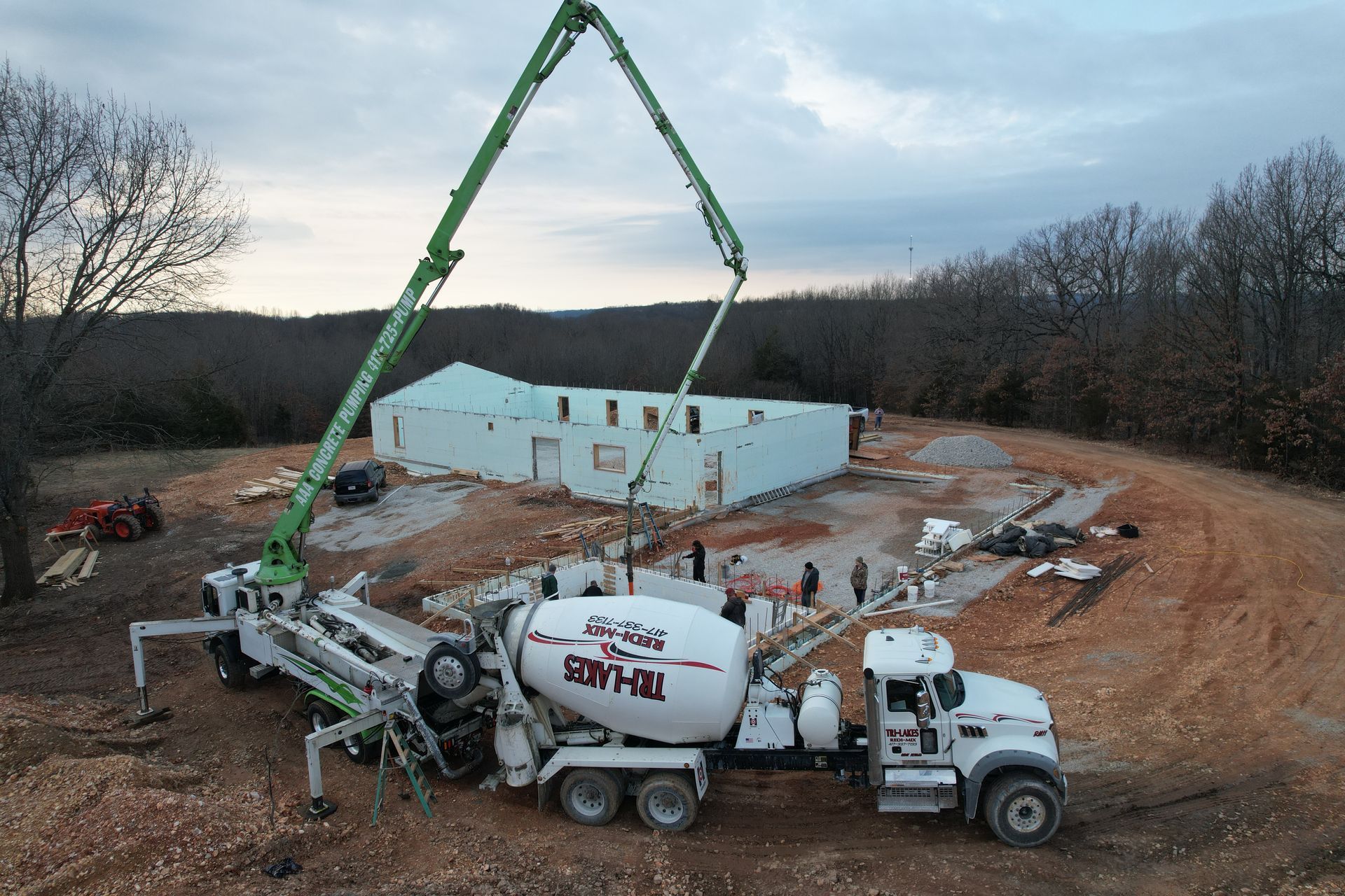 Monolithic concrete pour for insulated concrete form custom home in winter | Ozark, MO
