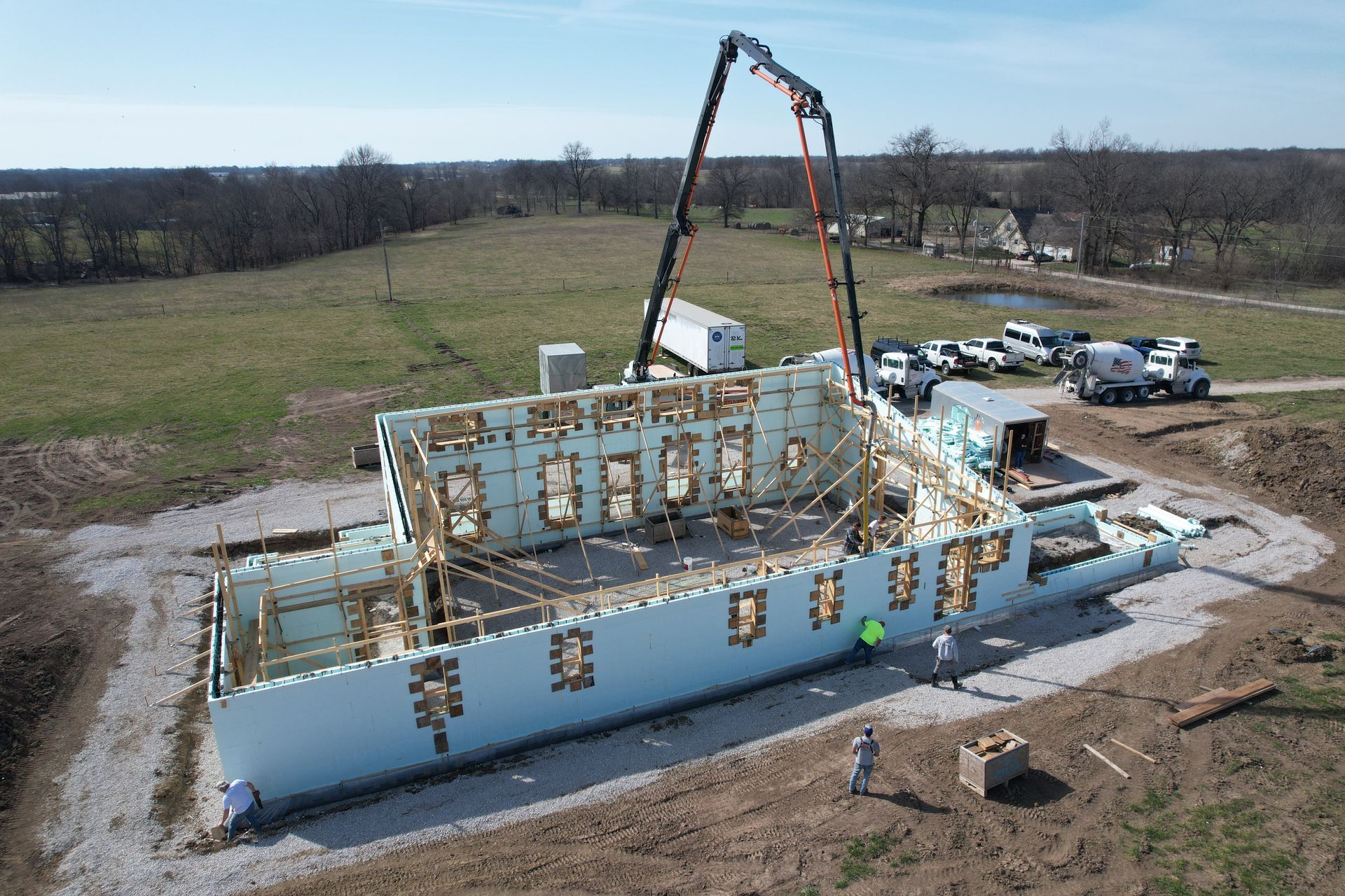 Concrete pump truck and custom home built with insulated concrete forms | Nixa, MO