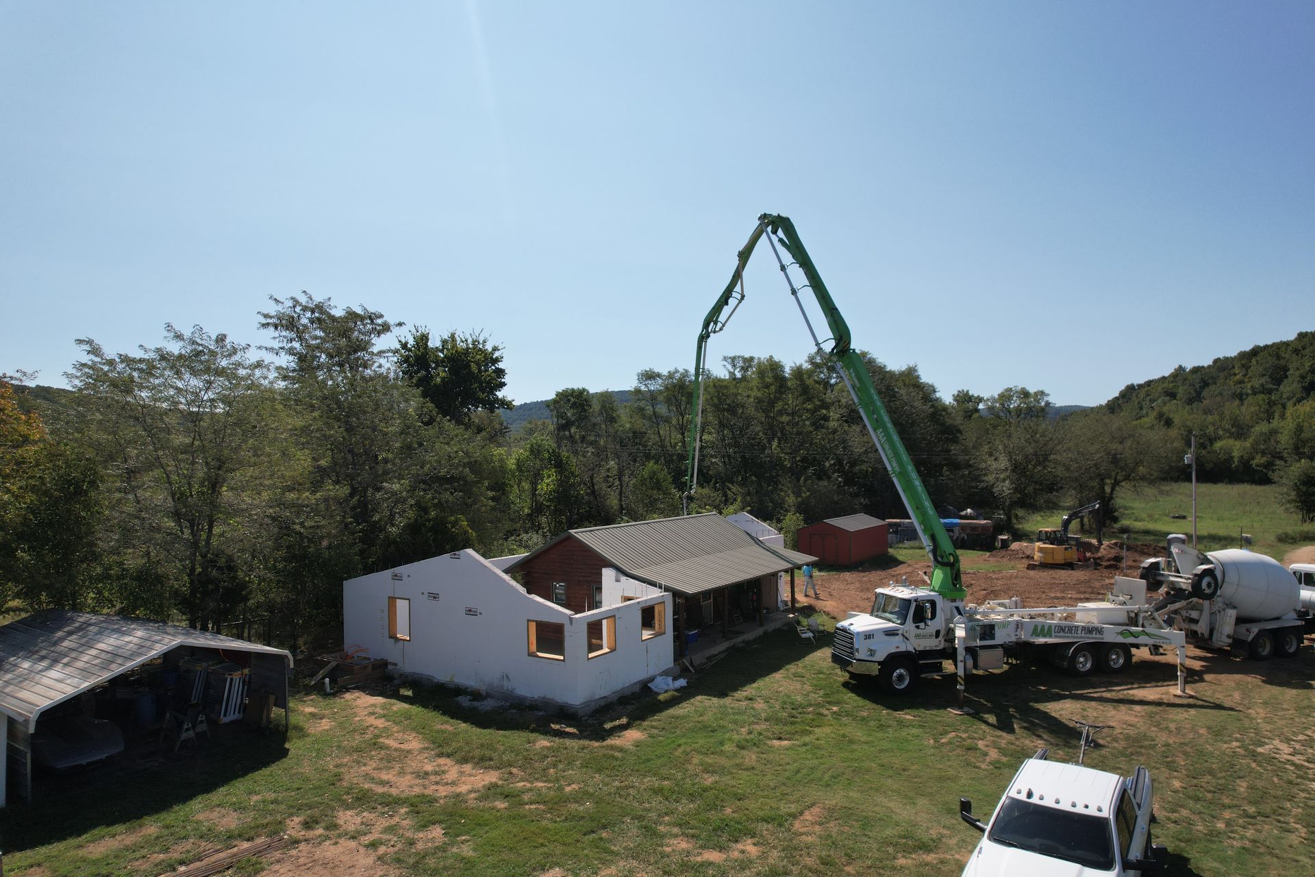 Log cabin with insulated concrete form home addition in the Ozarks | Northwest Arkansas