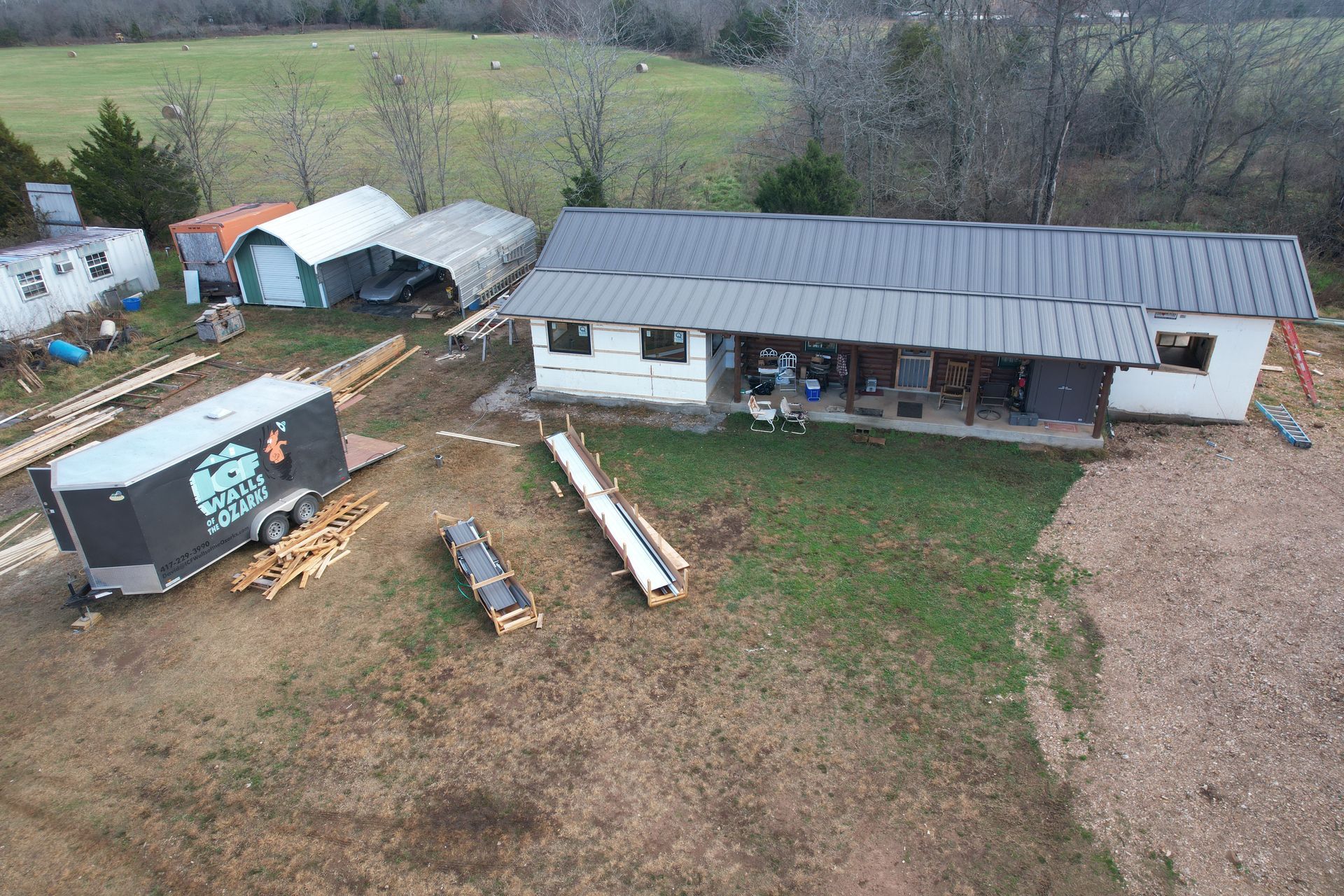 Log cabin with ICF home addition and standing seam hidden fastener steel roof | Alpena, AR