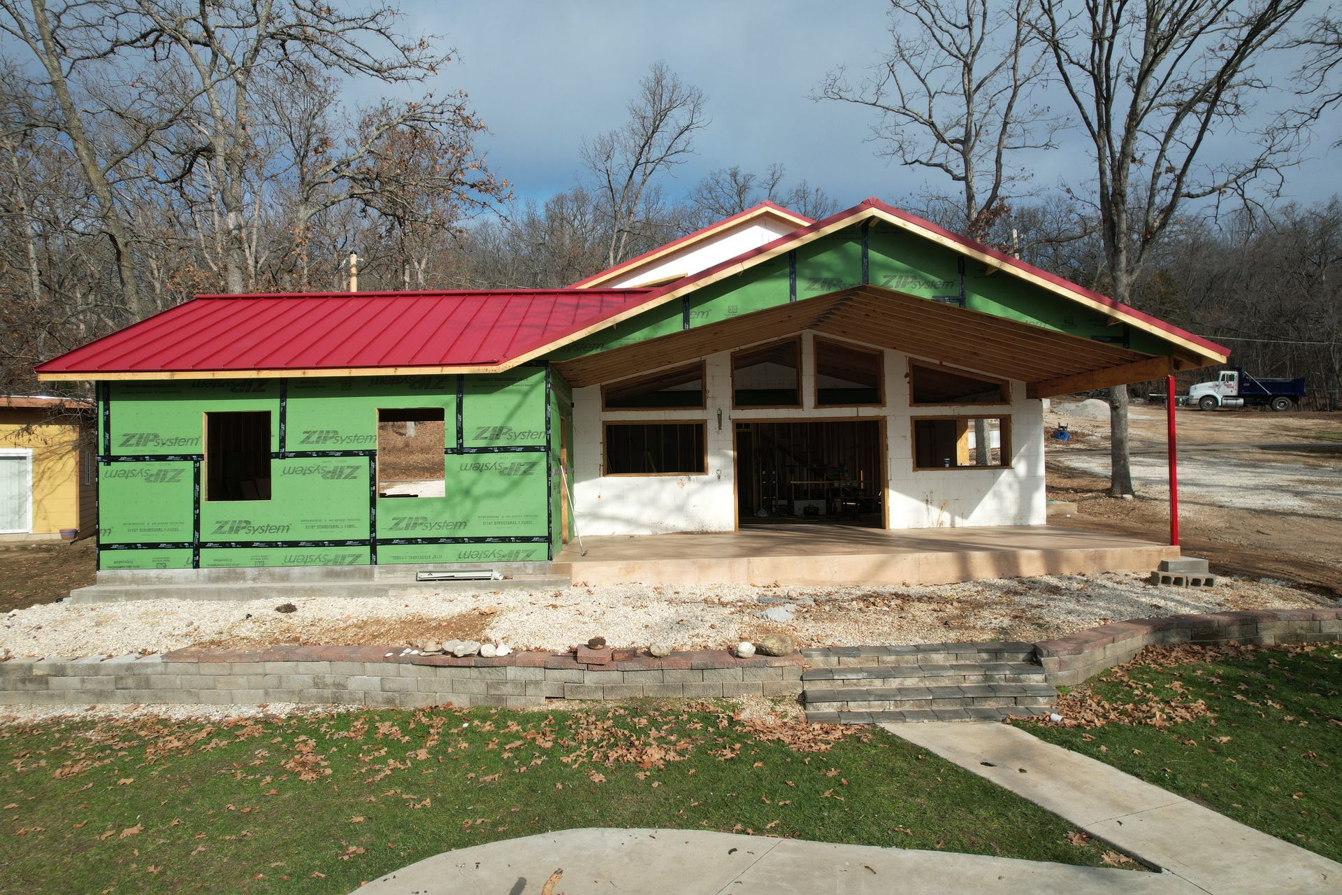 Custom ICF home with standing seam hidden fastener steel roof at Lake of the Ozarks | Gravois Mills, MO