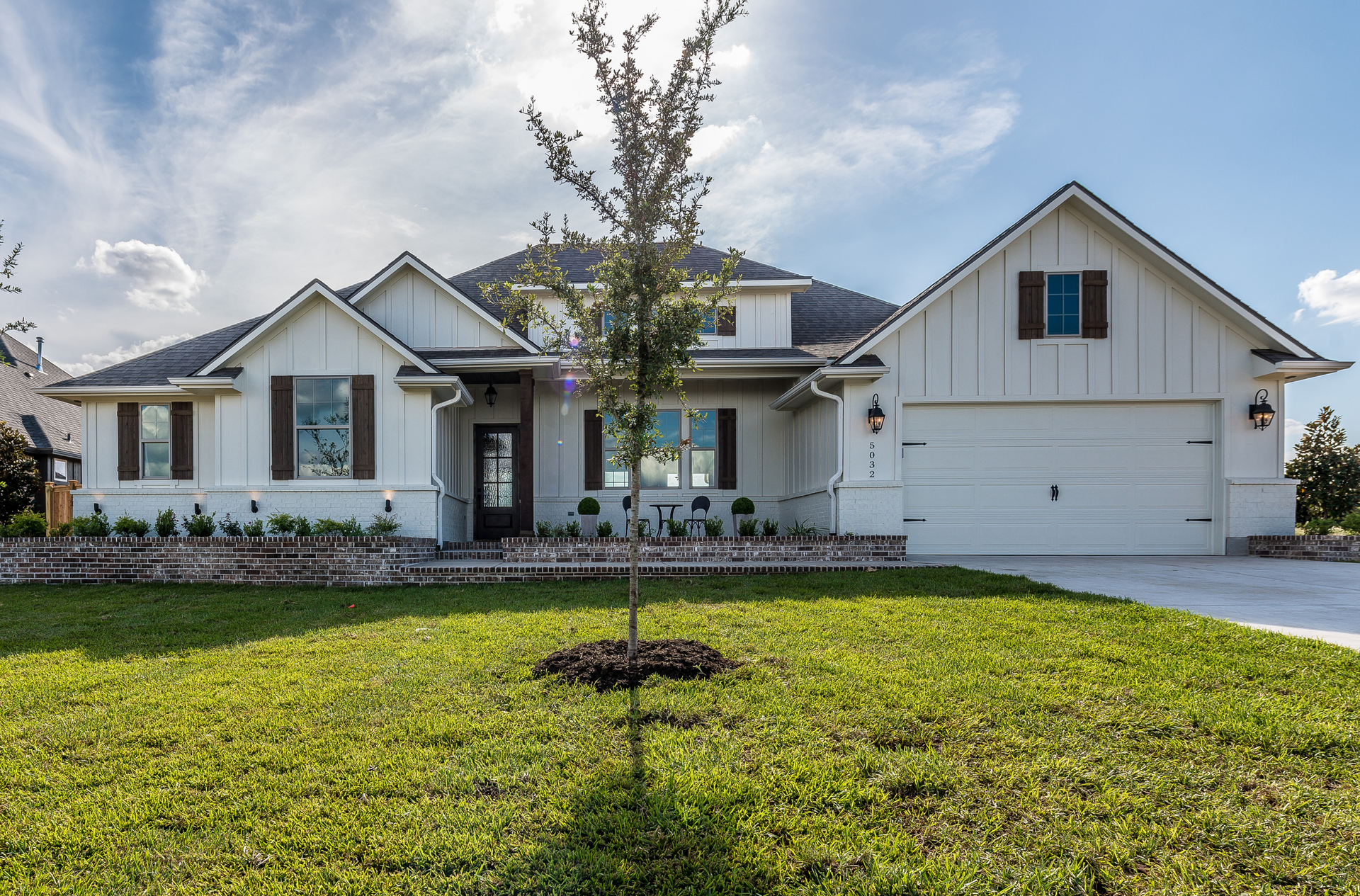 An ICF farmhouse with a tree in front of it | Branson MO