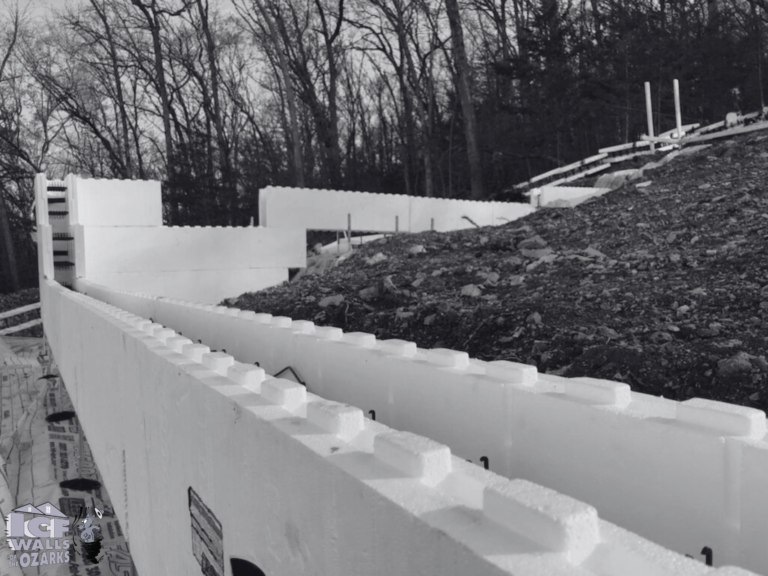 A black and white photo of a building under construction- ICF footers and Walls in Branson MO