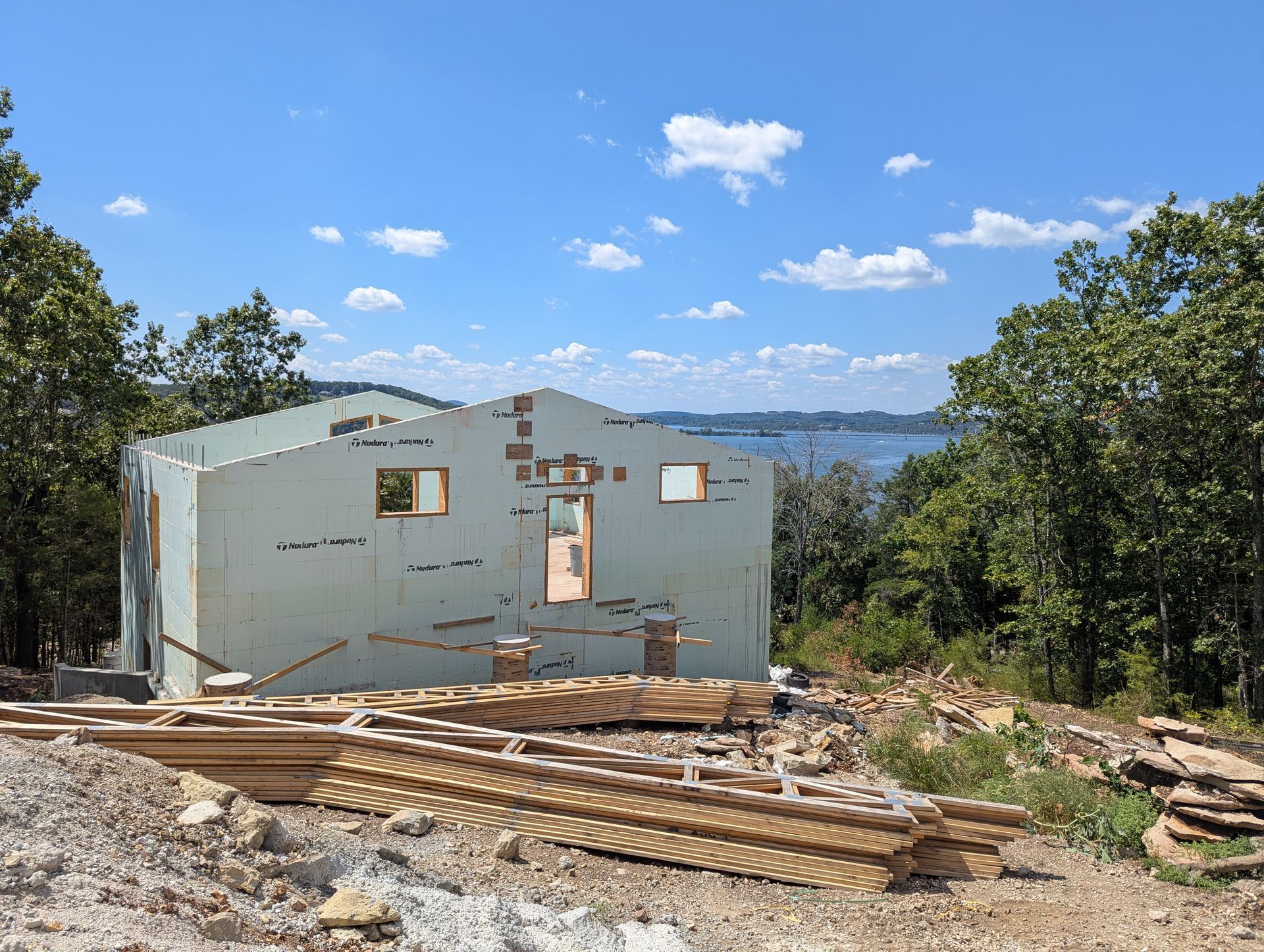 Nudura ICF custom home build with custom engineered trusses ready to be installed | Reeds Spring, MO