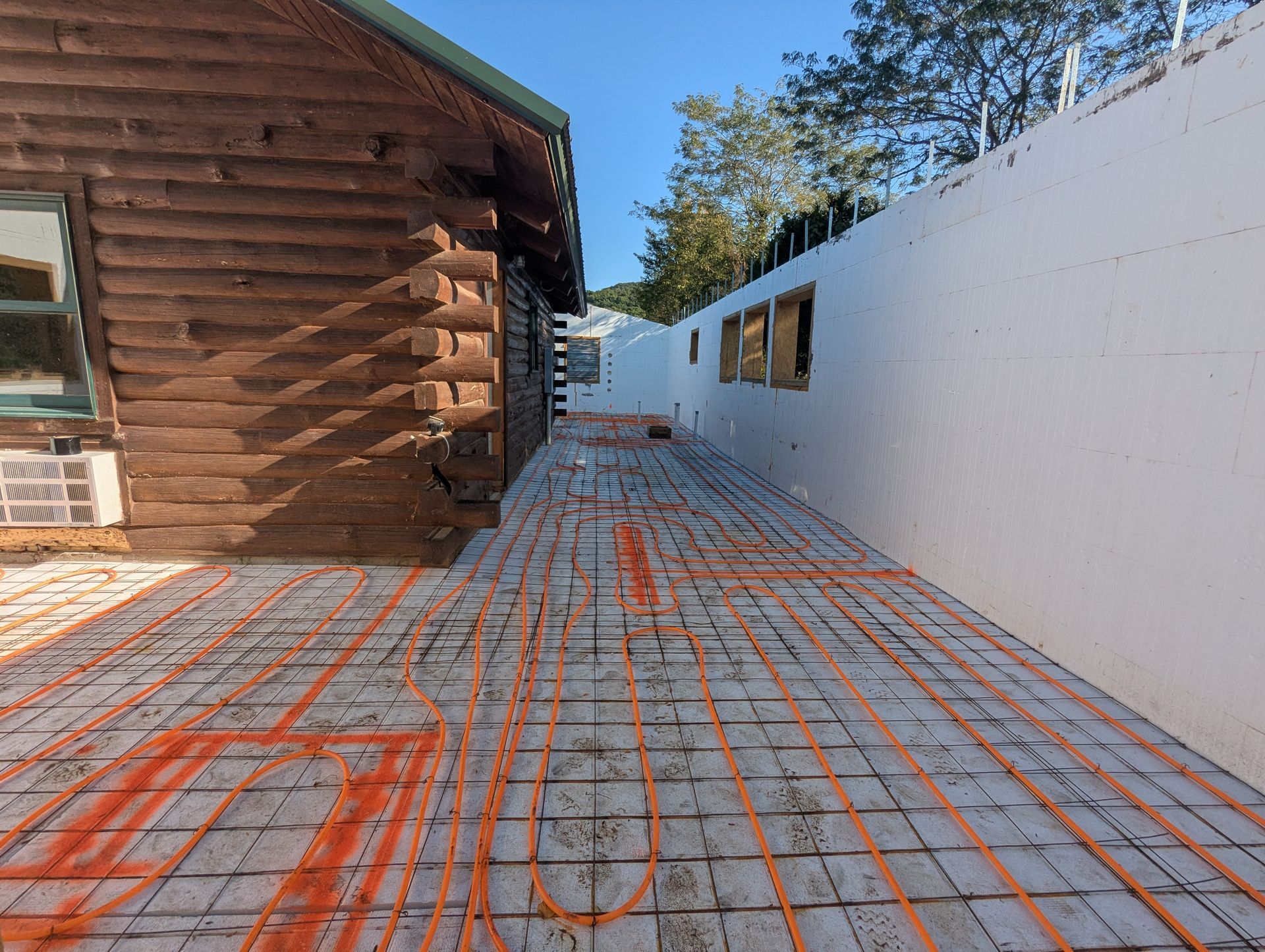 Radiant heat tubing installed on insulated slab foundation in ICF custom home build | Alpena, AR