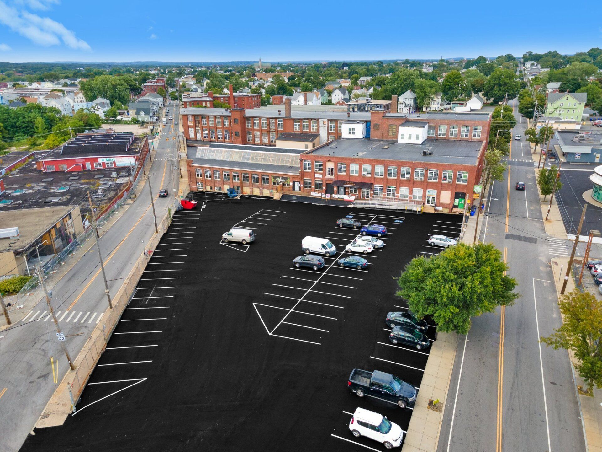 An aerial view of a parking lot in a small town
