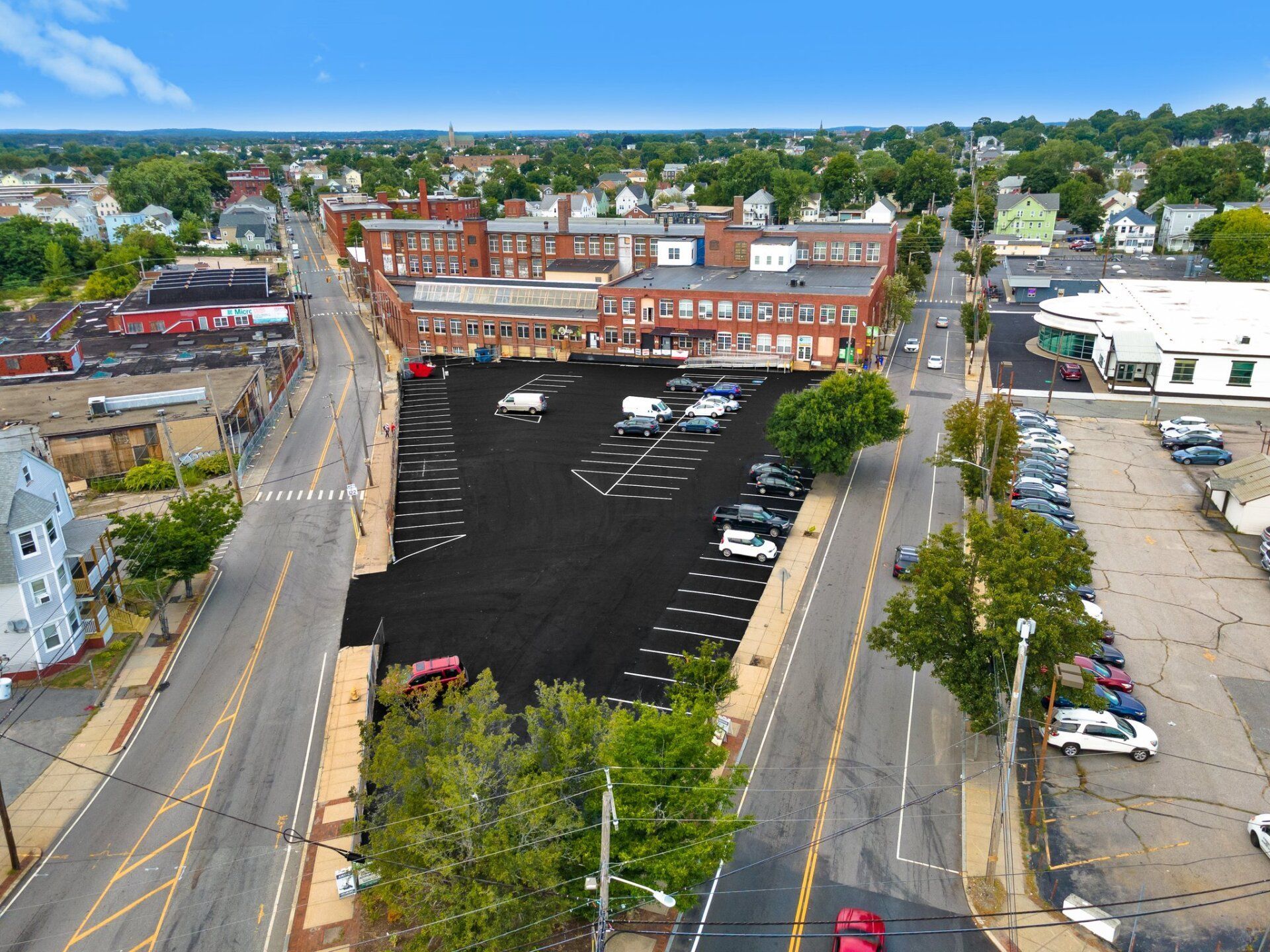 An aerial view of a parking lot in a small town