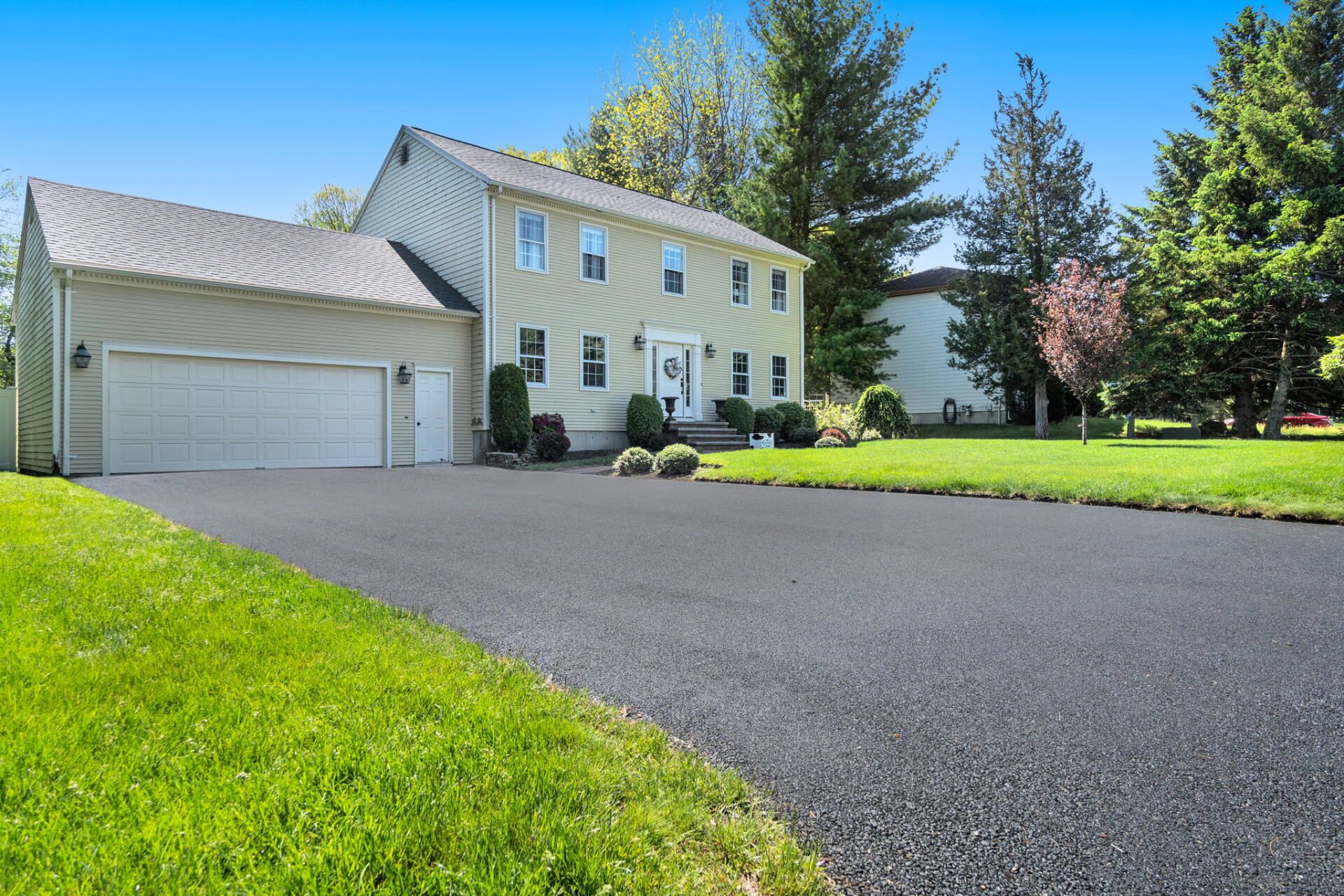 a house with a new paved driveway