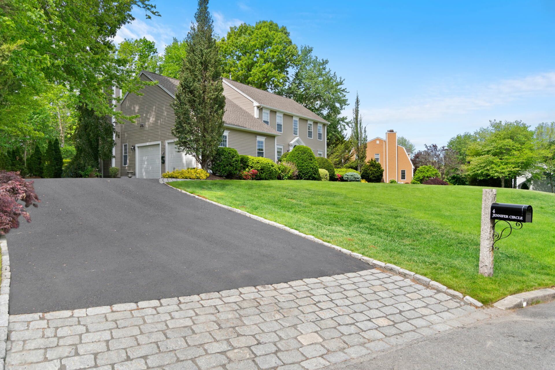 a house with a new paved driveway