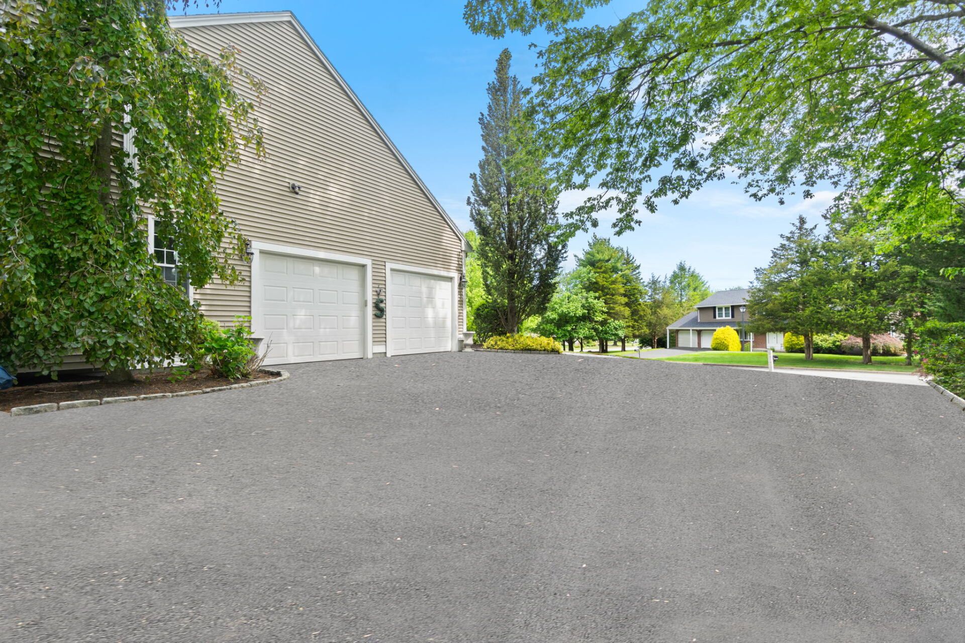 a house with a new paved driveway