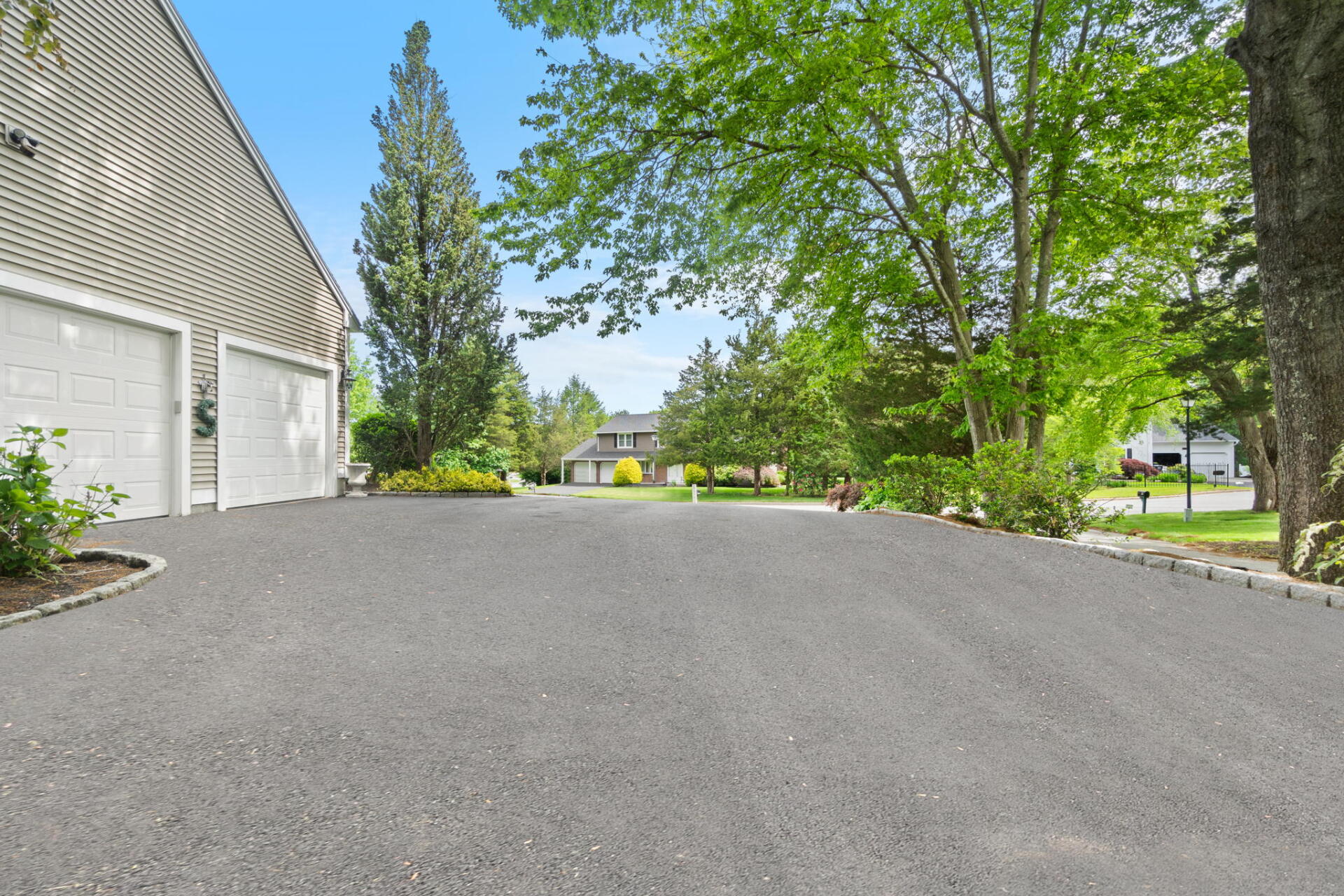 a house with a new paved driveway