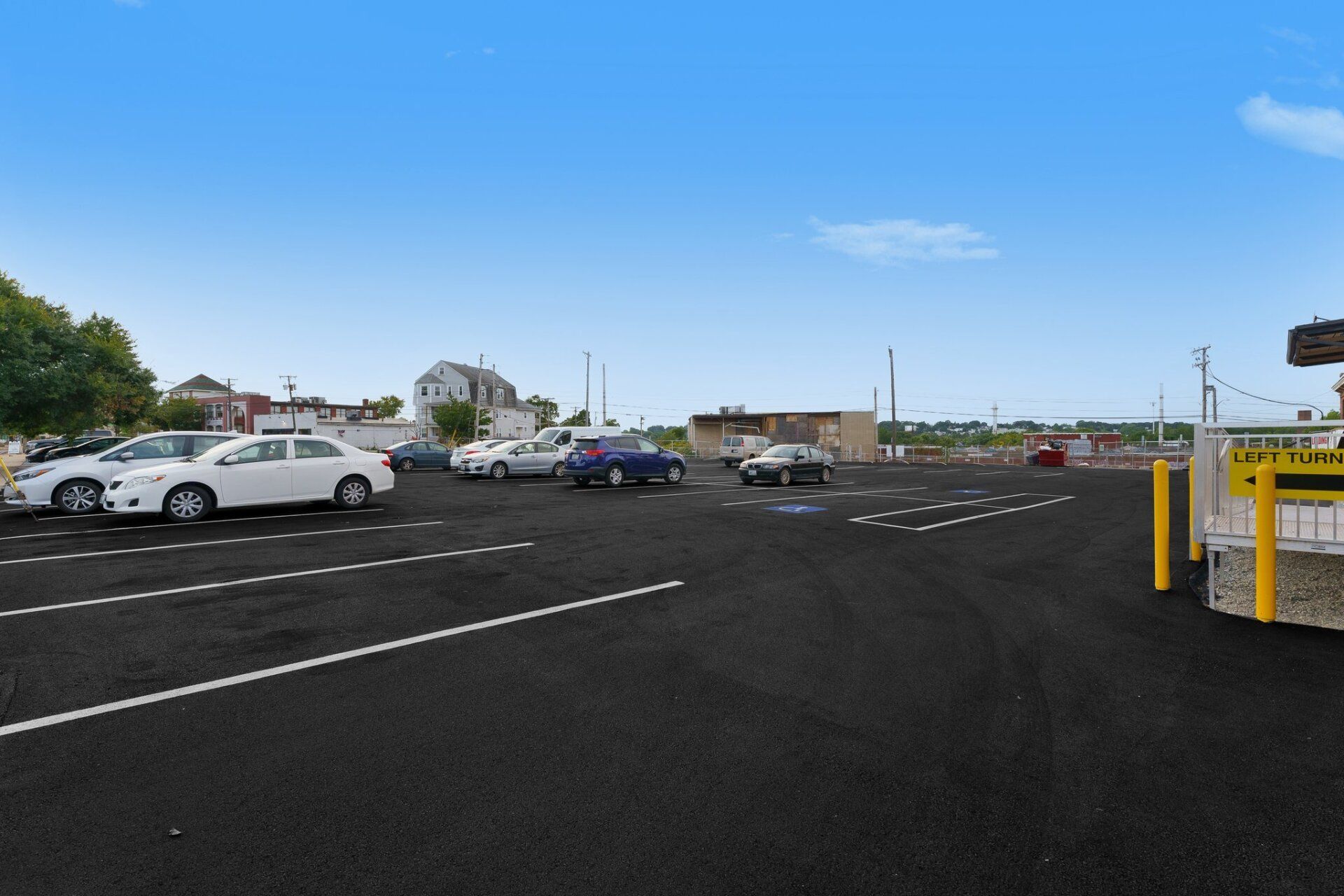 A parking lot with a lot of cars parked in it