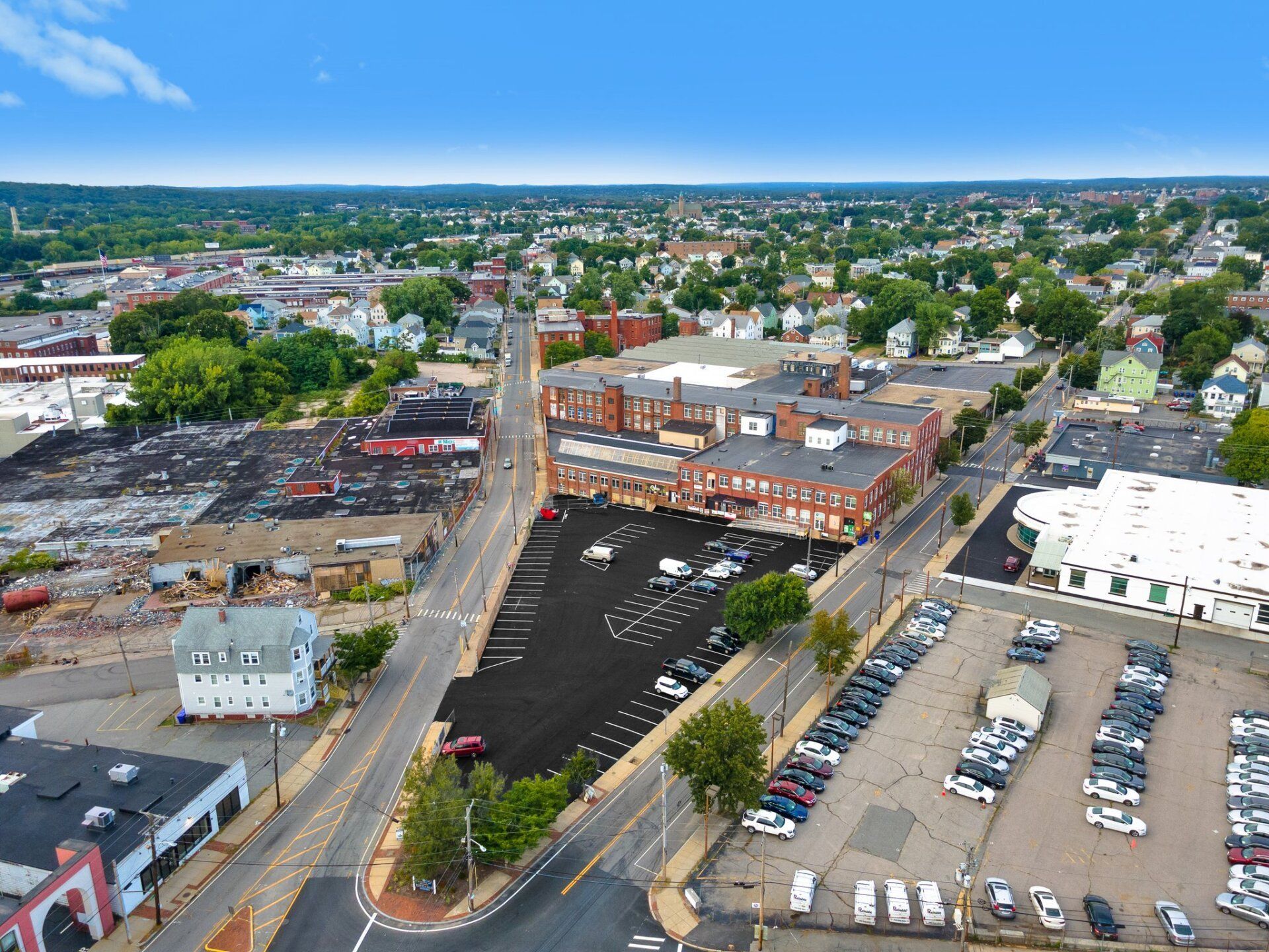 a parking lot with a new paved driveway