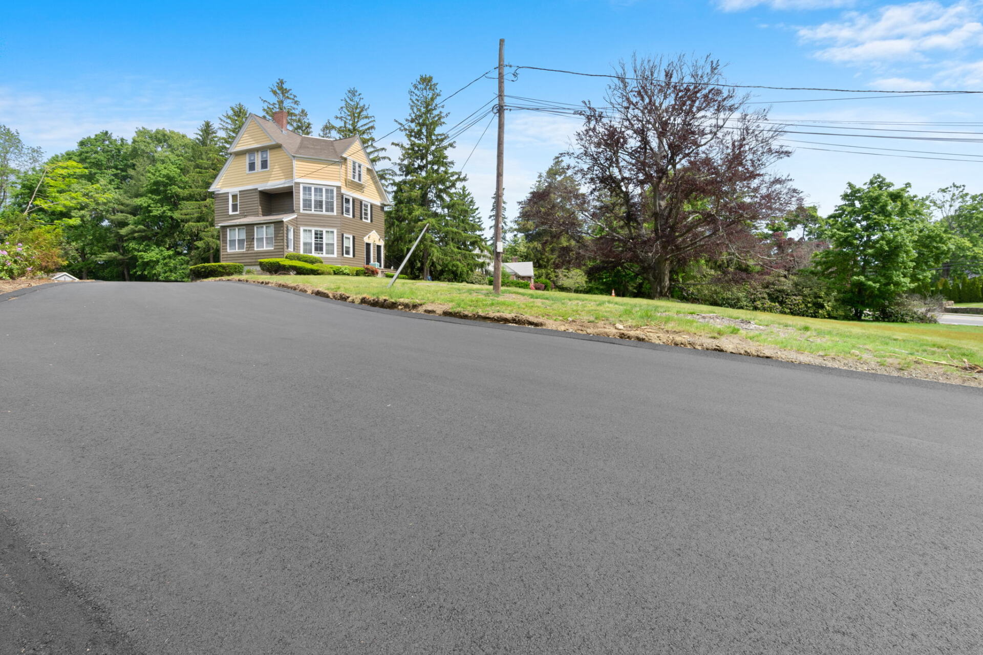 a house with a new paved driveway