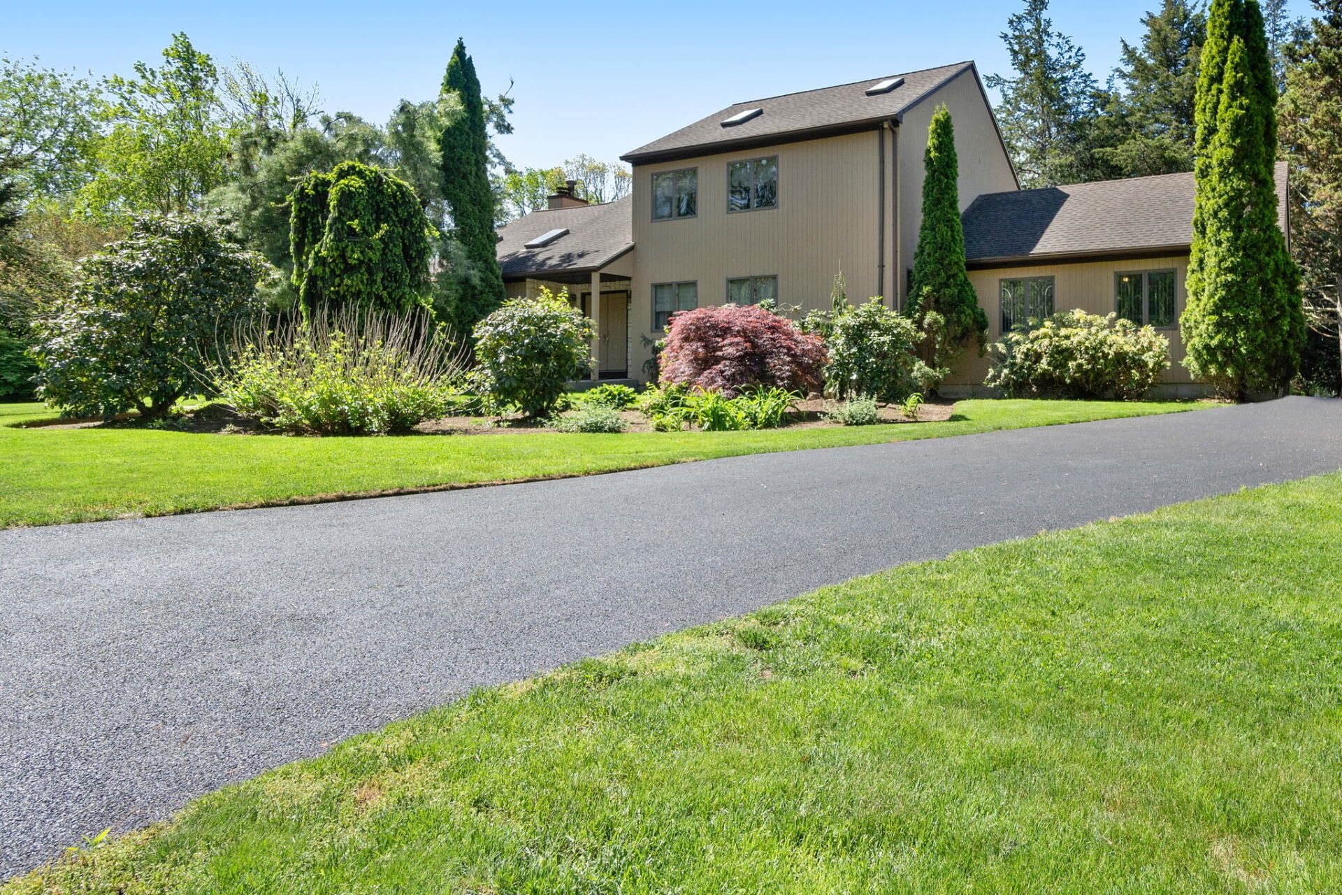 a house with a new paved driveway