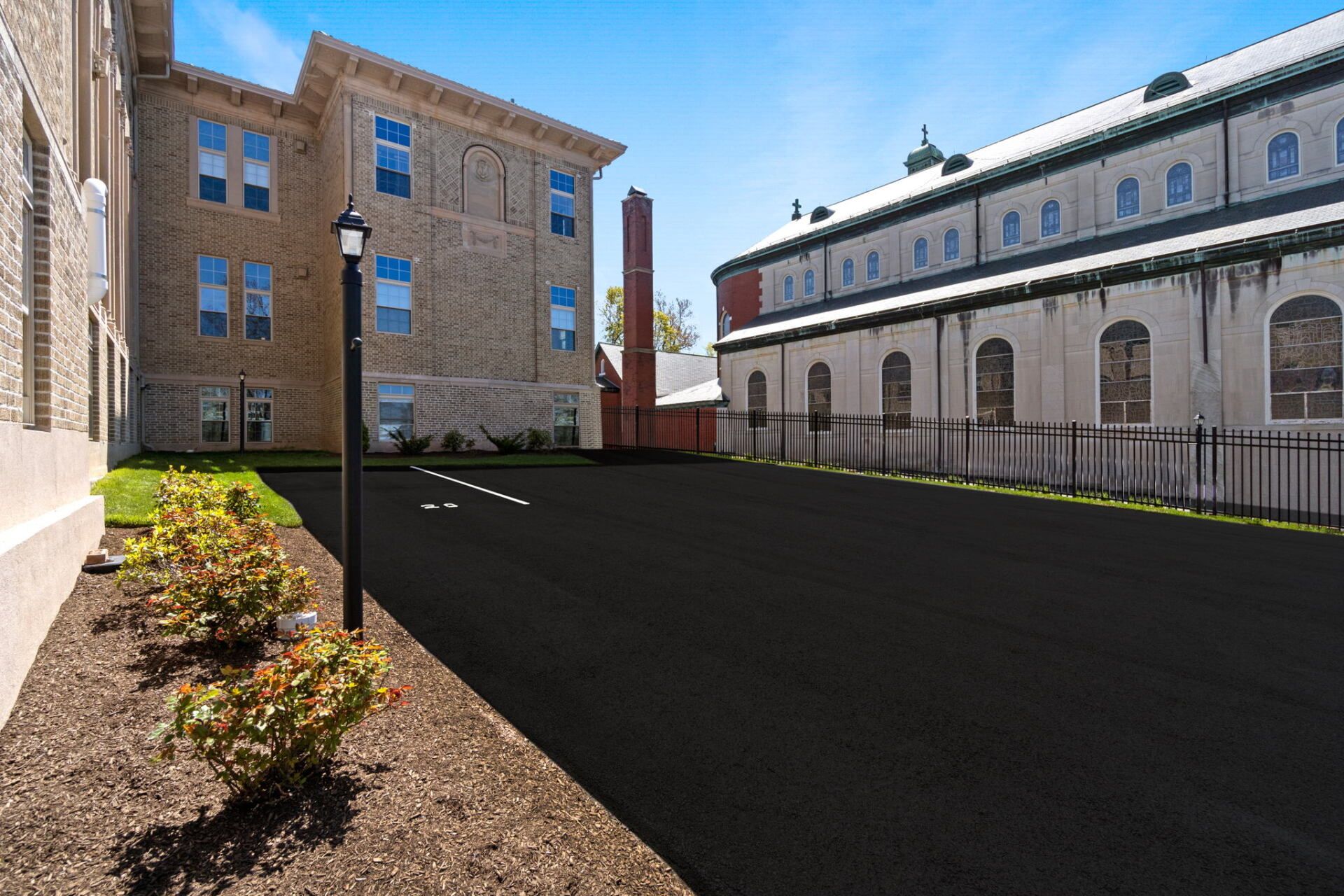 A large building with a parking lot in front of it