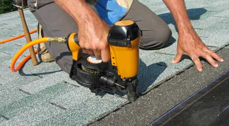 Man Installing Shingles to a Roof — Binghamton, NY — Robert J Green & Son