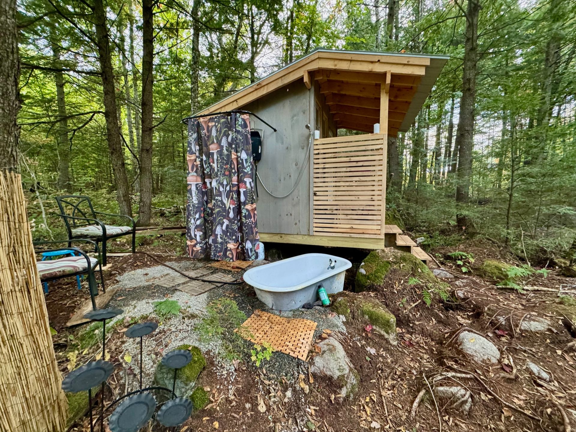 The outside of the sauna with a bath tub