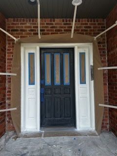 Front door with brick - Spanaway, WA | Top Grade Development
