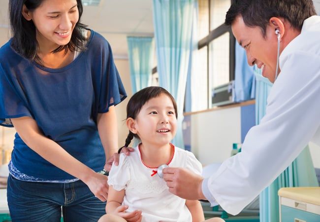 Doctor with mom and daughter
