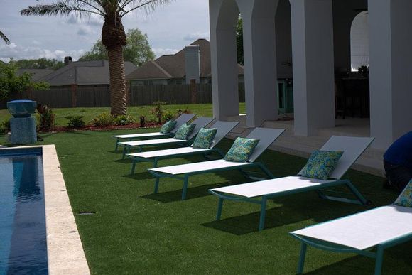 Artificial turf around swimming pool. Beau Monde installed Lafayette, LA