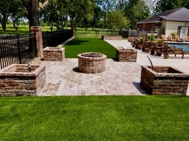 Beau Monde installed patio, firepit, brick planter columns, artificial grass Robert's Cove, LA
