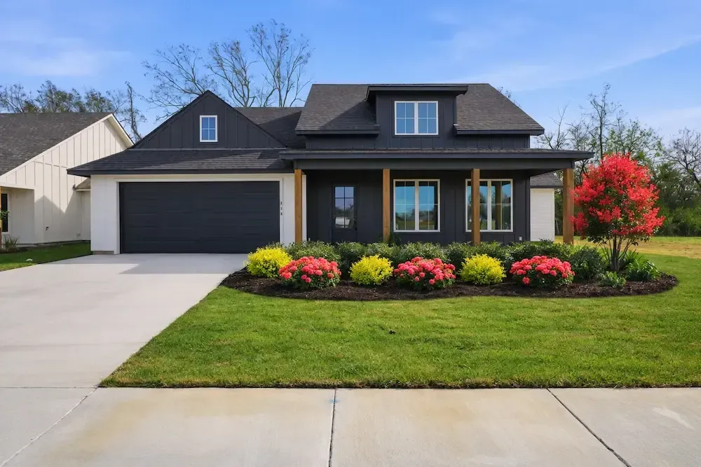 Modern farmhouse in Lafayette, LA with Zone 9 full‑sun landscape 