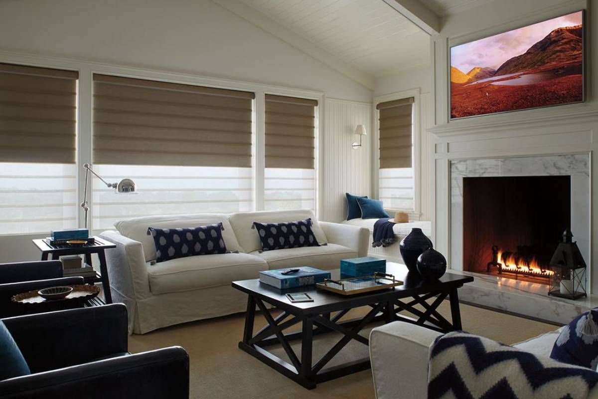 Comfy living room with plush couches and Hunter Douglas Vignette® Roman Shades decorating the windows at Rachel Brosky Interiors near Elizabethtown, Kentucky (KY)