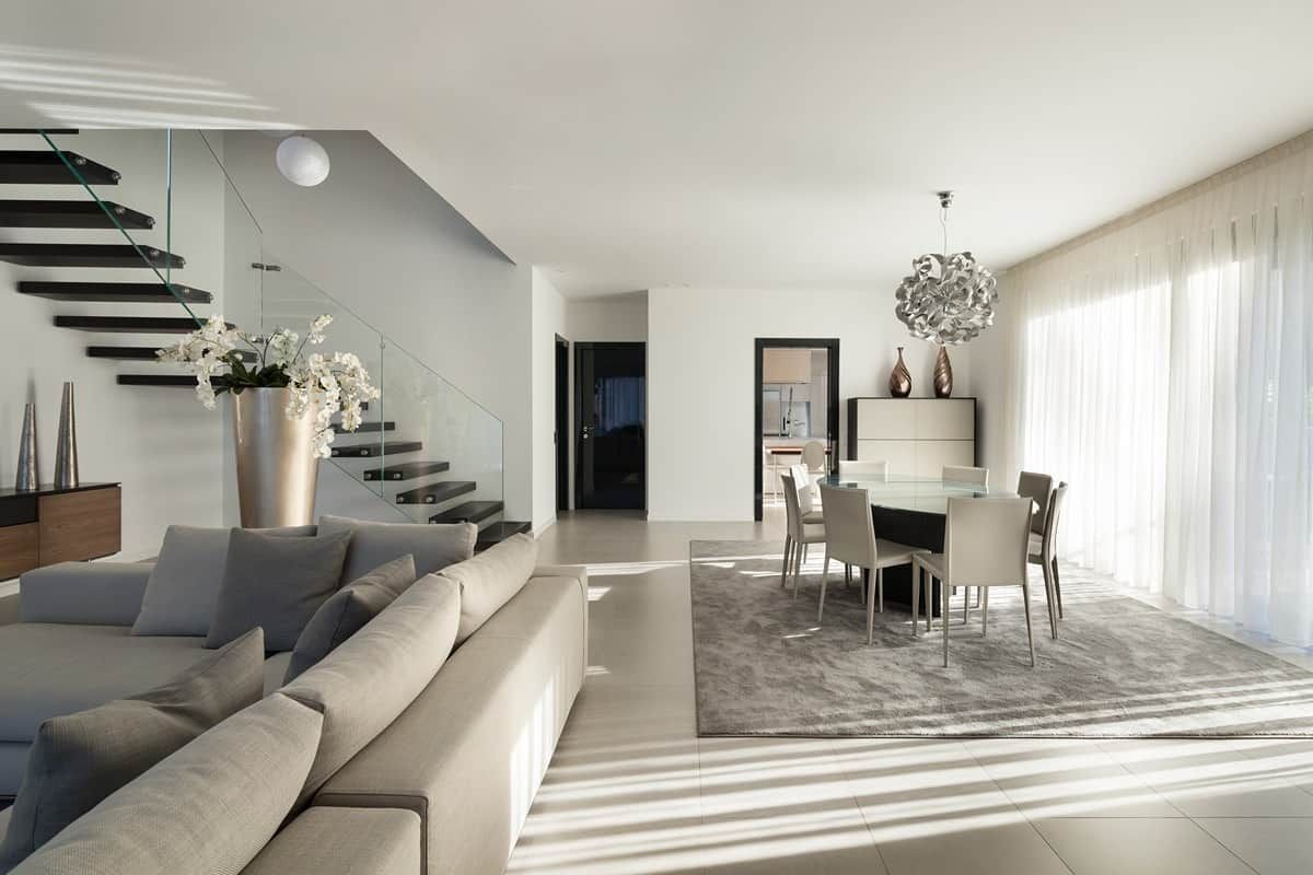 Gray-colored modern interior with sheer window shades on a wide window near Elizabethtown, KY