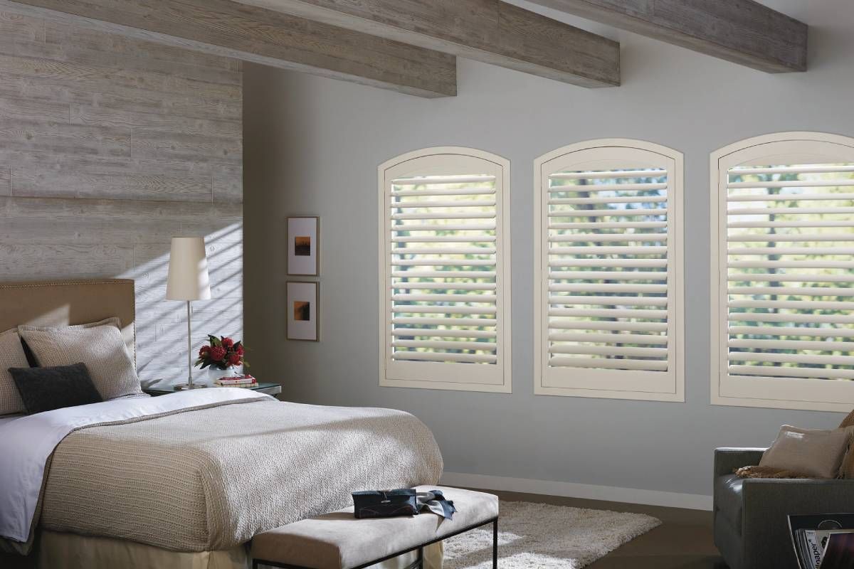 Hunter Douglas NewStyle® Composite Shutters primary bedroom windows with a traditional theme with rustic touches at Rachel Brosky Interiors near Elizabethtown, Kentucky (KY)