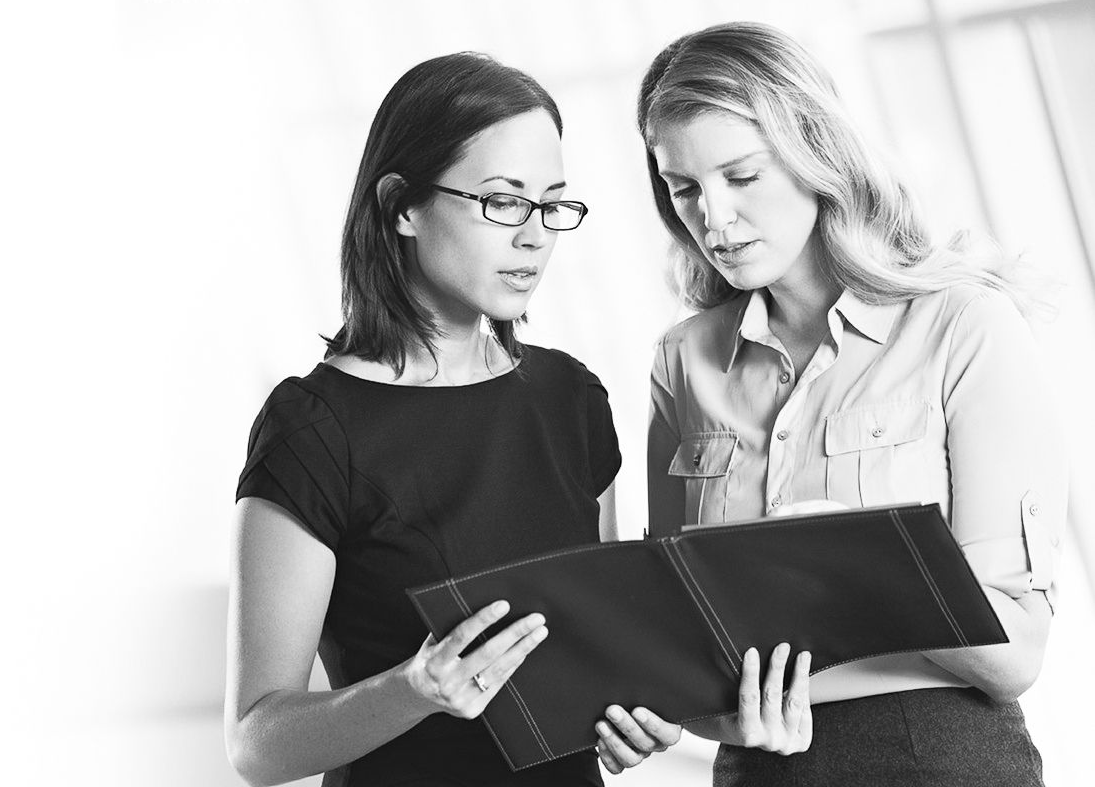Two women looking at portfolio solution for IVF Insurance