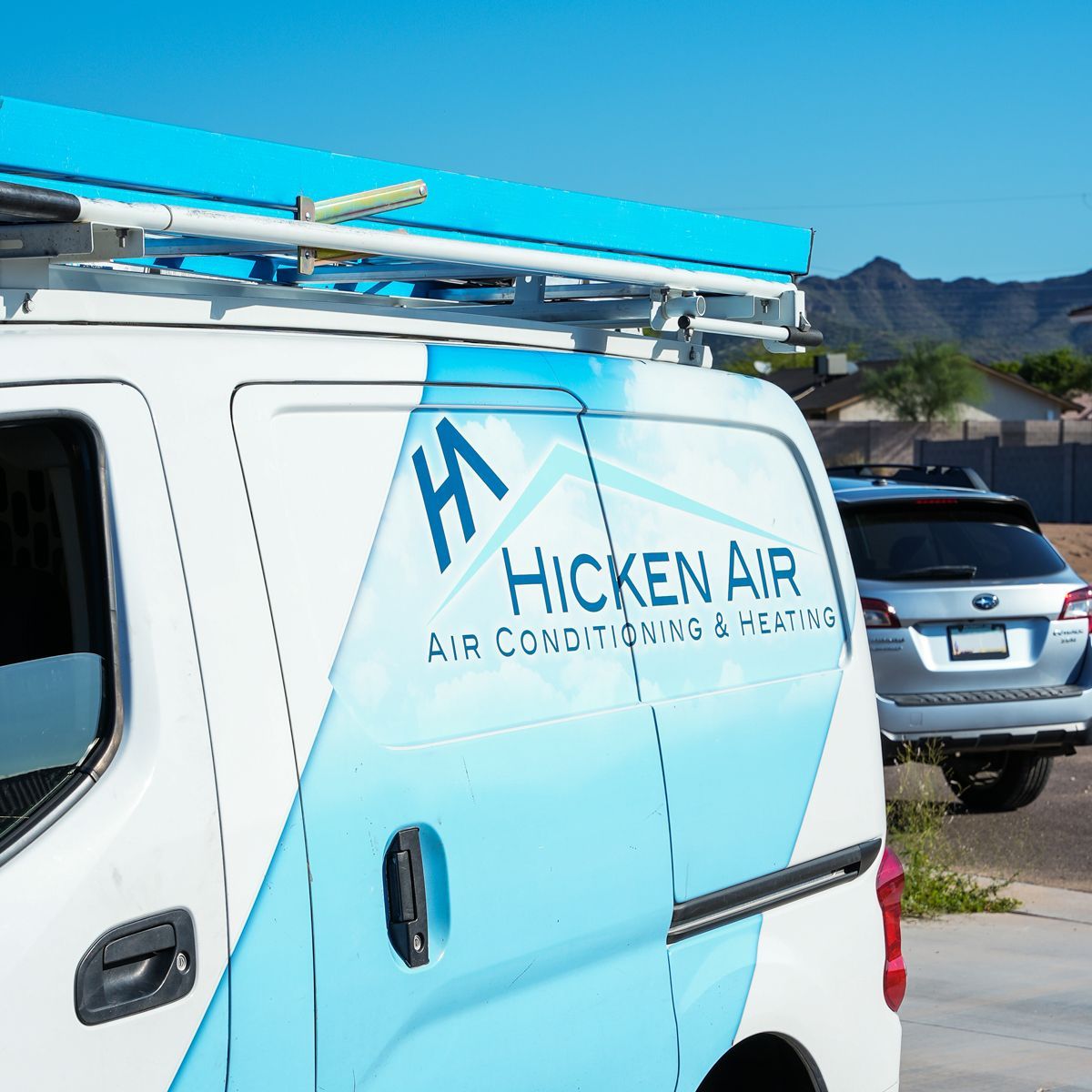 A bunch of trucks are parked on the side of the road.