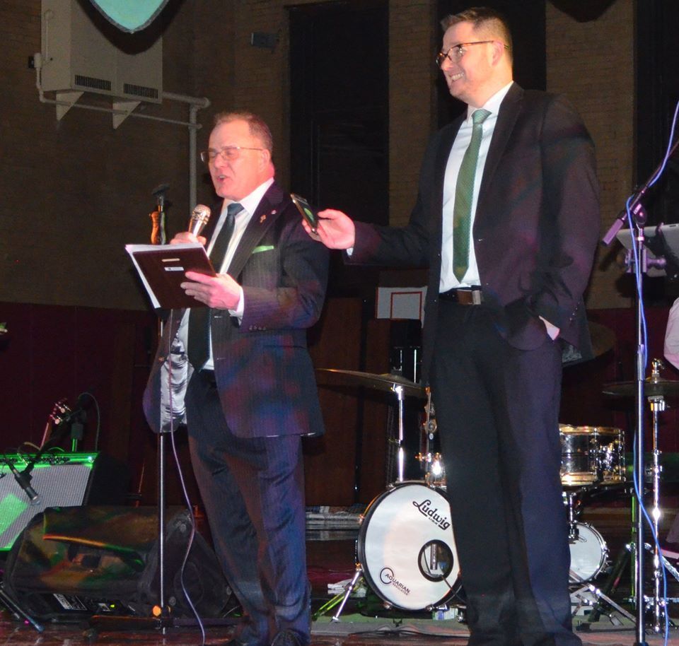 Two men standing in front of a ludwig drum