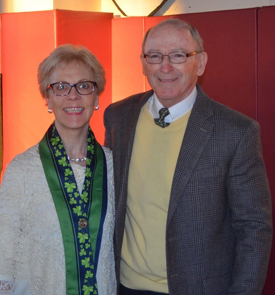 A man and a woman are posing for a picture together