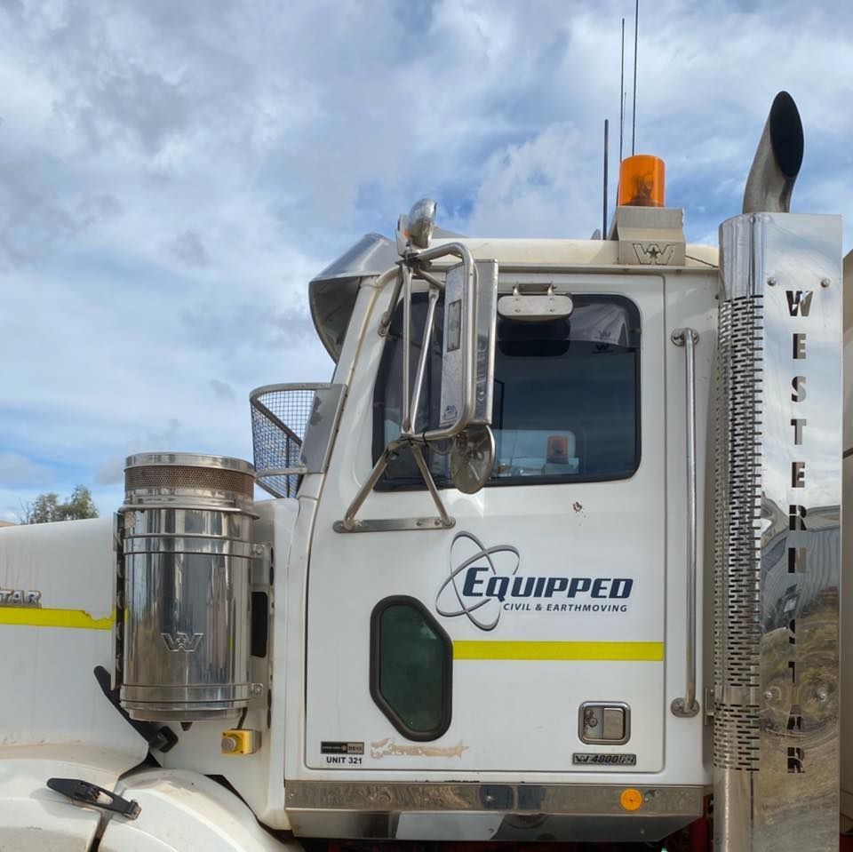 A white truck with the word equipped on the side