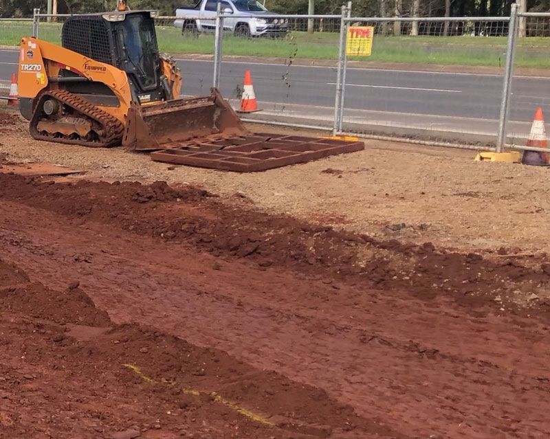 A bulldozer is moving dirt on a construction site.