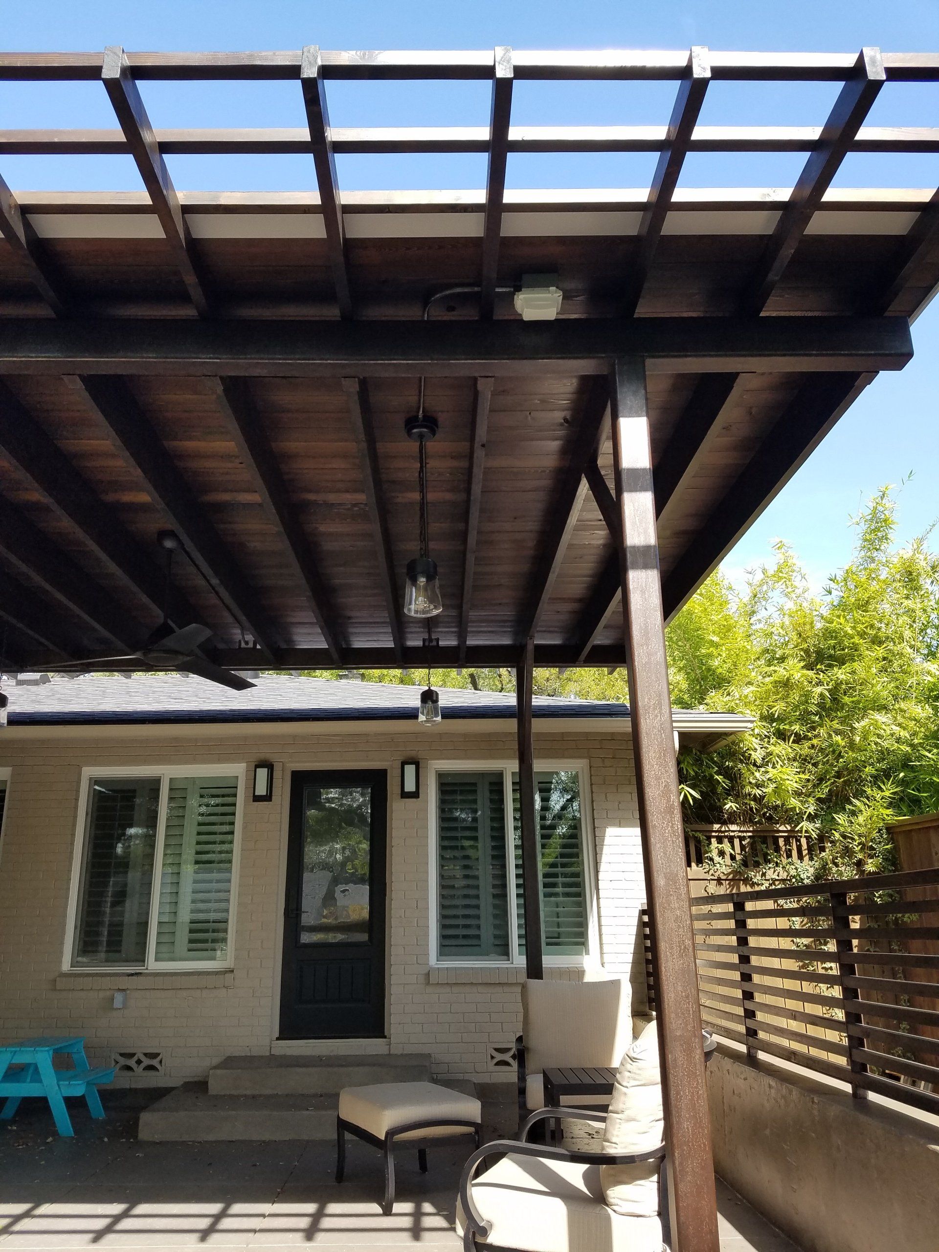 Outdoor lighting on a covered patio.