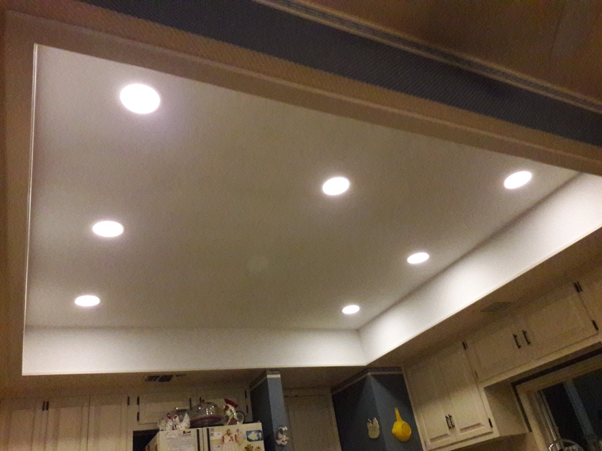 Ceiling view with recessed lighting up to code.