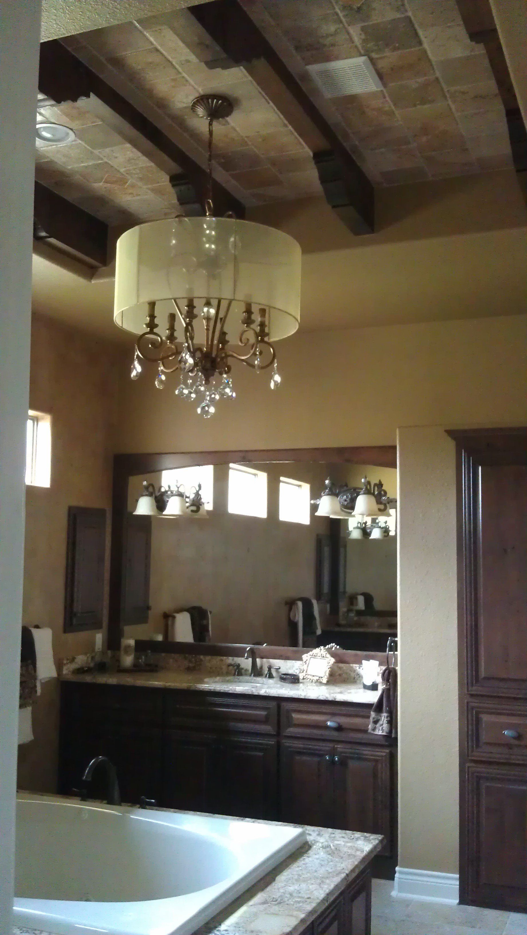 Exquisite lighting fixtures in a large bathroom.