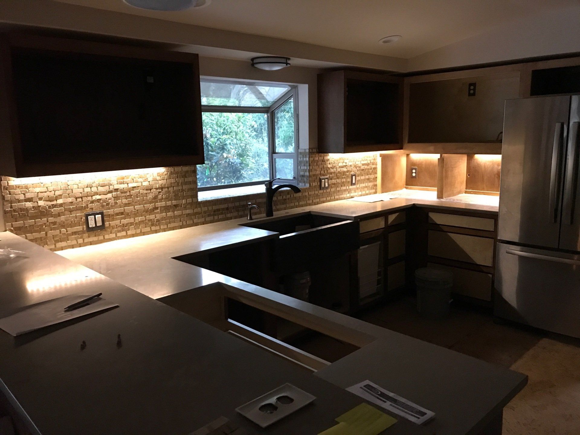 Modern kitchen with ambient lighting under the cabinets.