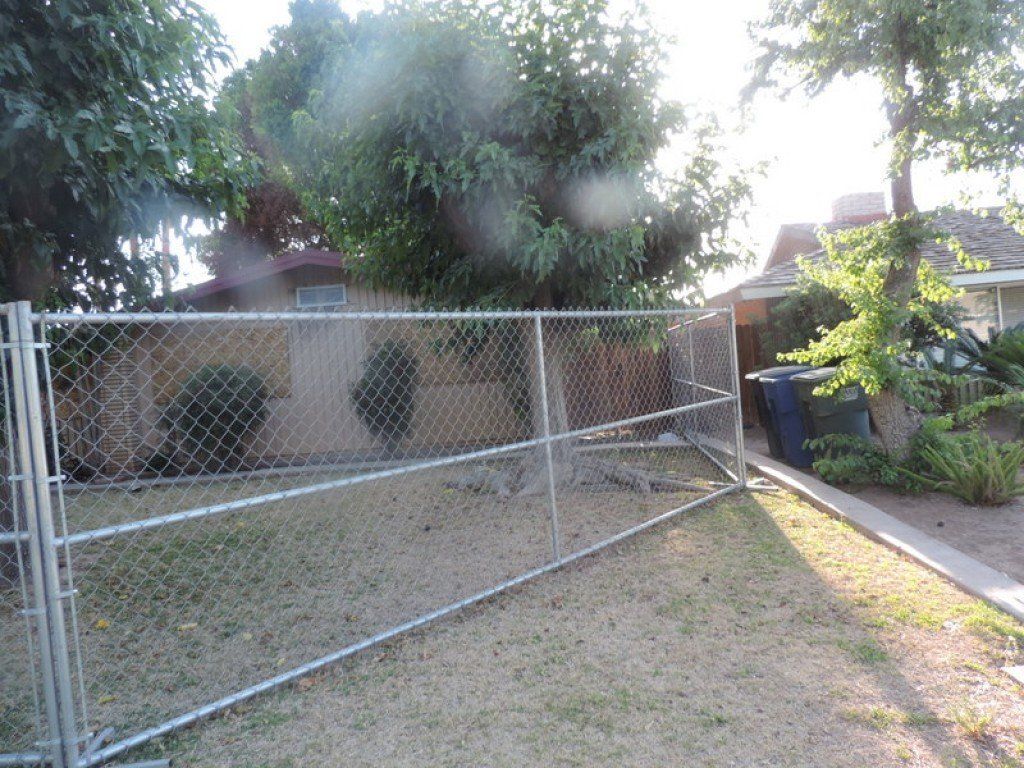 House with Chain Link Fence — Imperial, CA — NS Construction