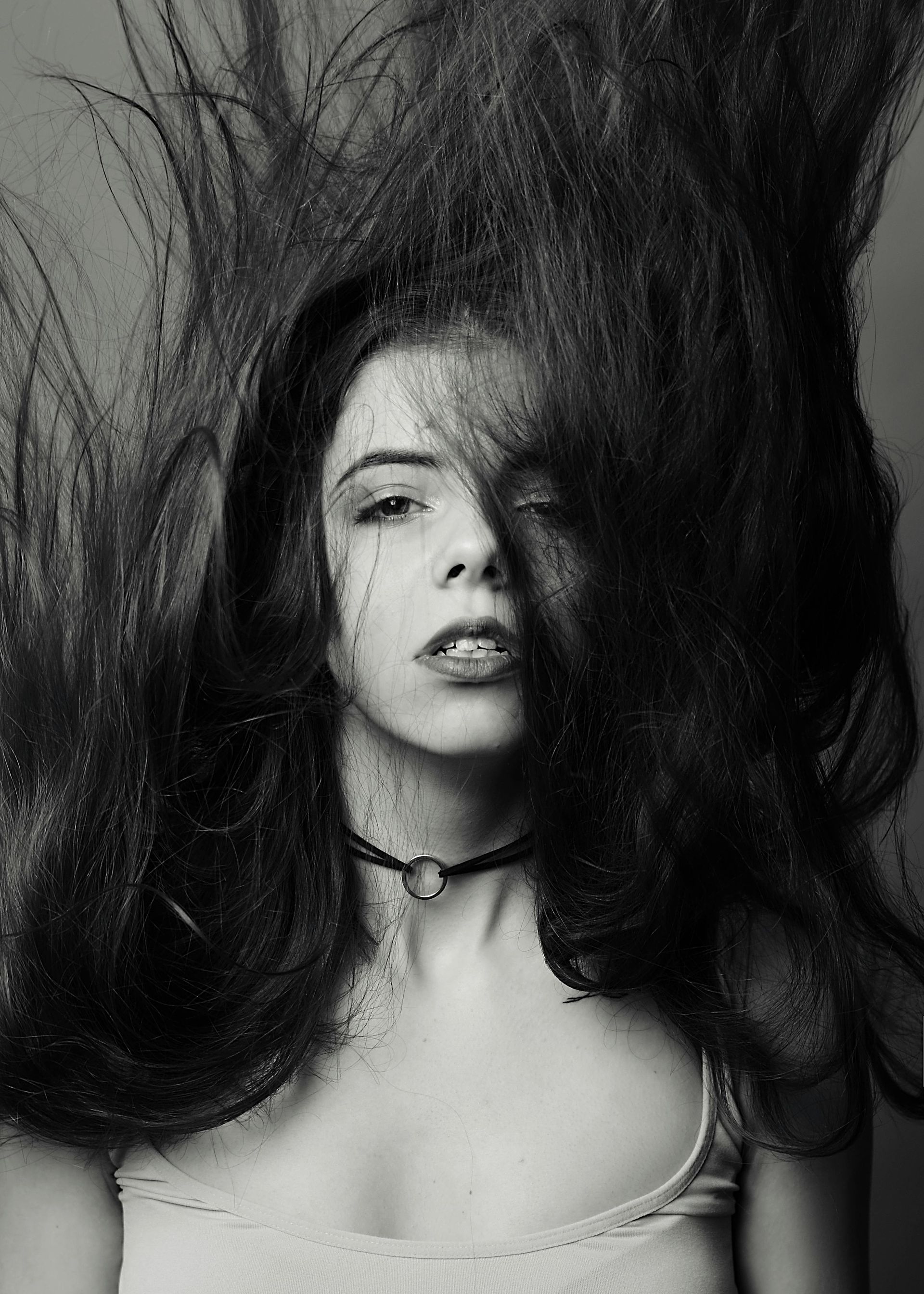 A woman with her long hair blowing in the wind